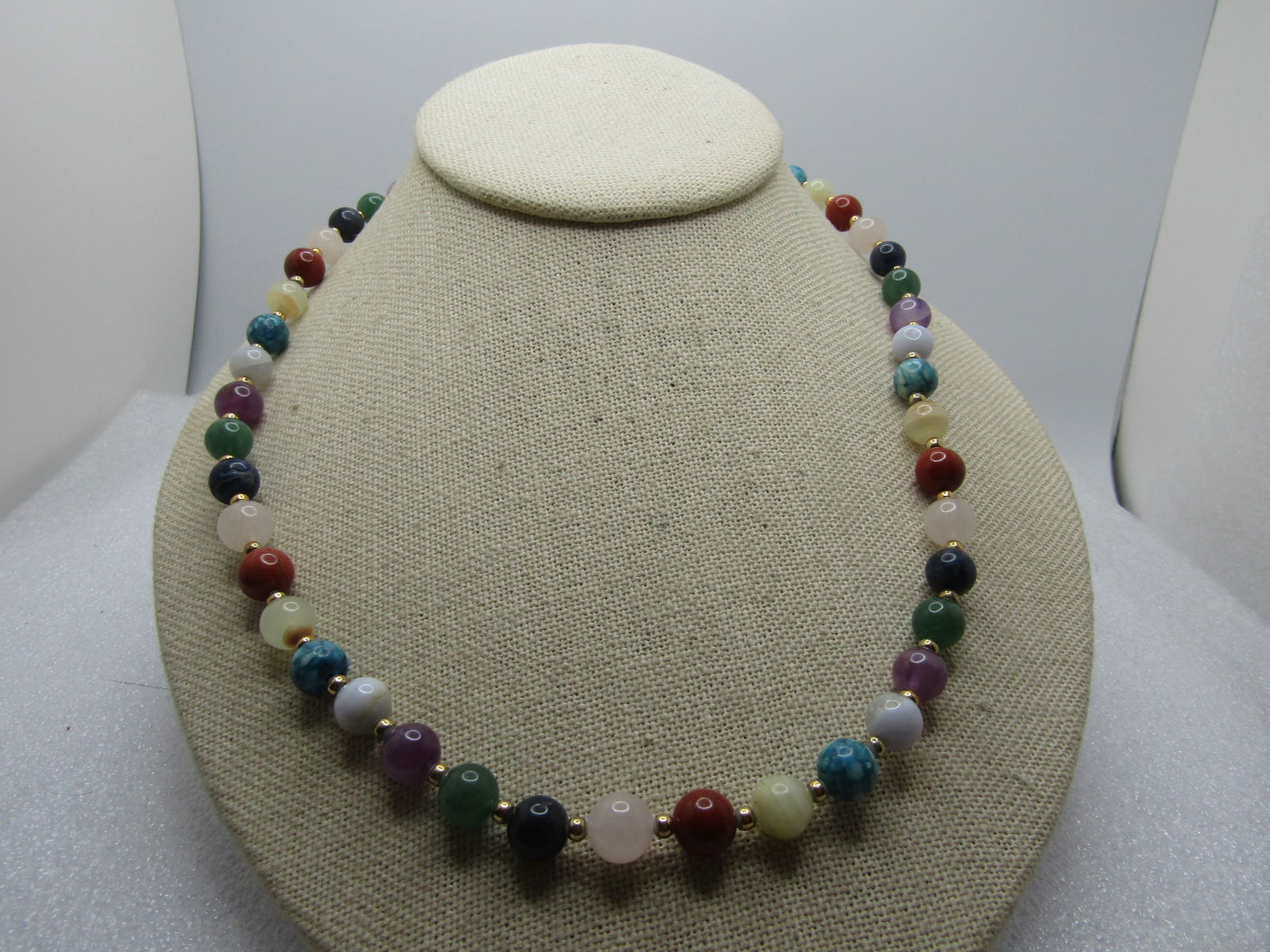 Vintage Mixed Green, Purple, Orange Jade & Agate Necklace, 24", 1960's-1970's.: Vintage Mixed Green, Purple, Orange Jade & Agate Necklace, 24", 1960's-1970's. The beads are appx. 7.5mm round with green, lavender, white, and an orange stone that tests as jade. There is quartz,