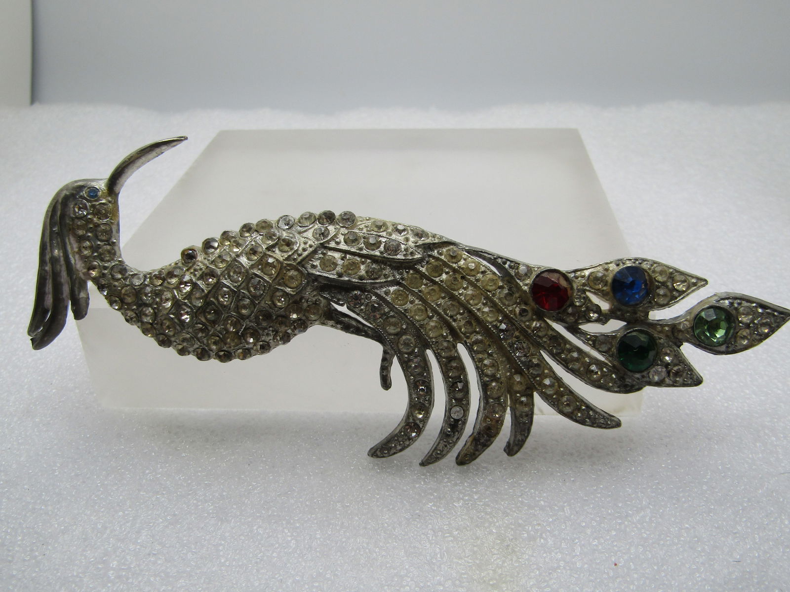 Vintage Rhinestone Peacock Brooch, Art Deco, 1930's-1940's, Cast Metal: Vintage Rhinestone Peacock Brooch, Art Deco, 1930's, Cast Metal. this is a large silver tone cast metal broock with clear stones throughout the body. There are four 6.5mm round gemtone rhinestones set