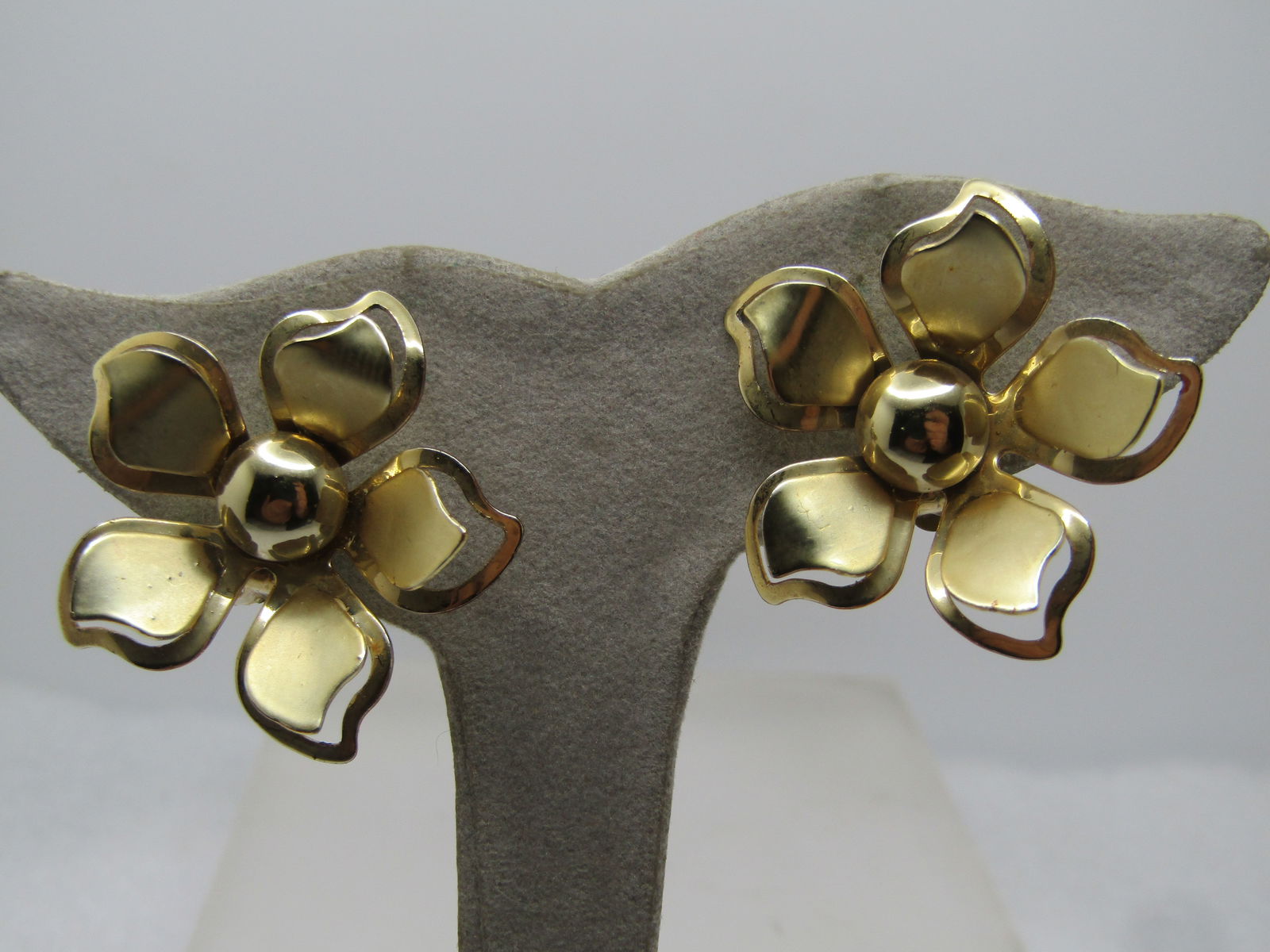 Vintage Blossom Clip Earrings, 1960's-1970's.: Vintage Blossom Clip Earrings, 1960's-1970's. Gold tone appx. 1.25" across, satin and shiney finish. 8mm recessed gold center bead with lower outline petal and raised inner petal. Not signed or