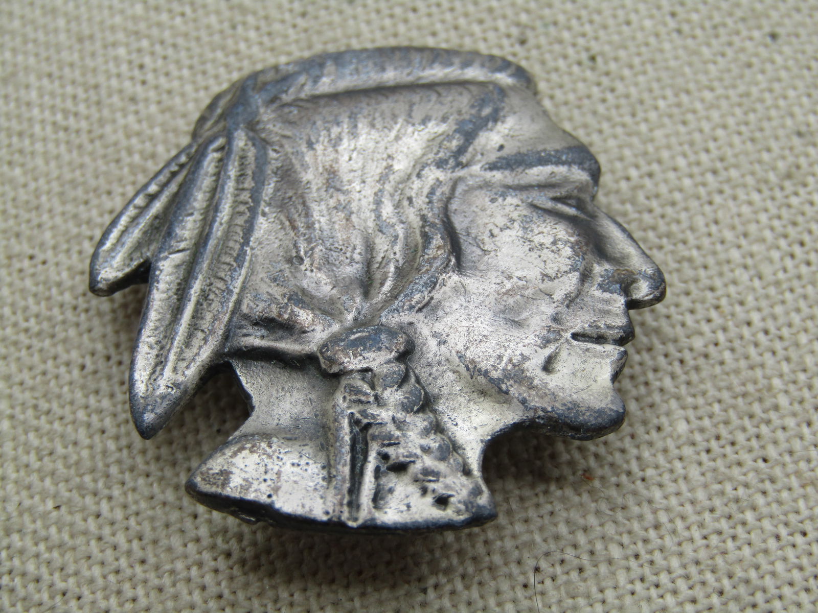 Vintage Pewter Carved Indian Head Brooch, 1960's-1970's: Vintage Pewter Carved Indian Head Brooch, 1960's-1970's. This is appx. 1.75" by 1.5". It is the same image as is on the Buffalo nickle just enlarged. It is not marked or signed. It has a locking