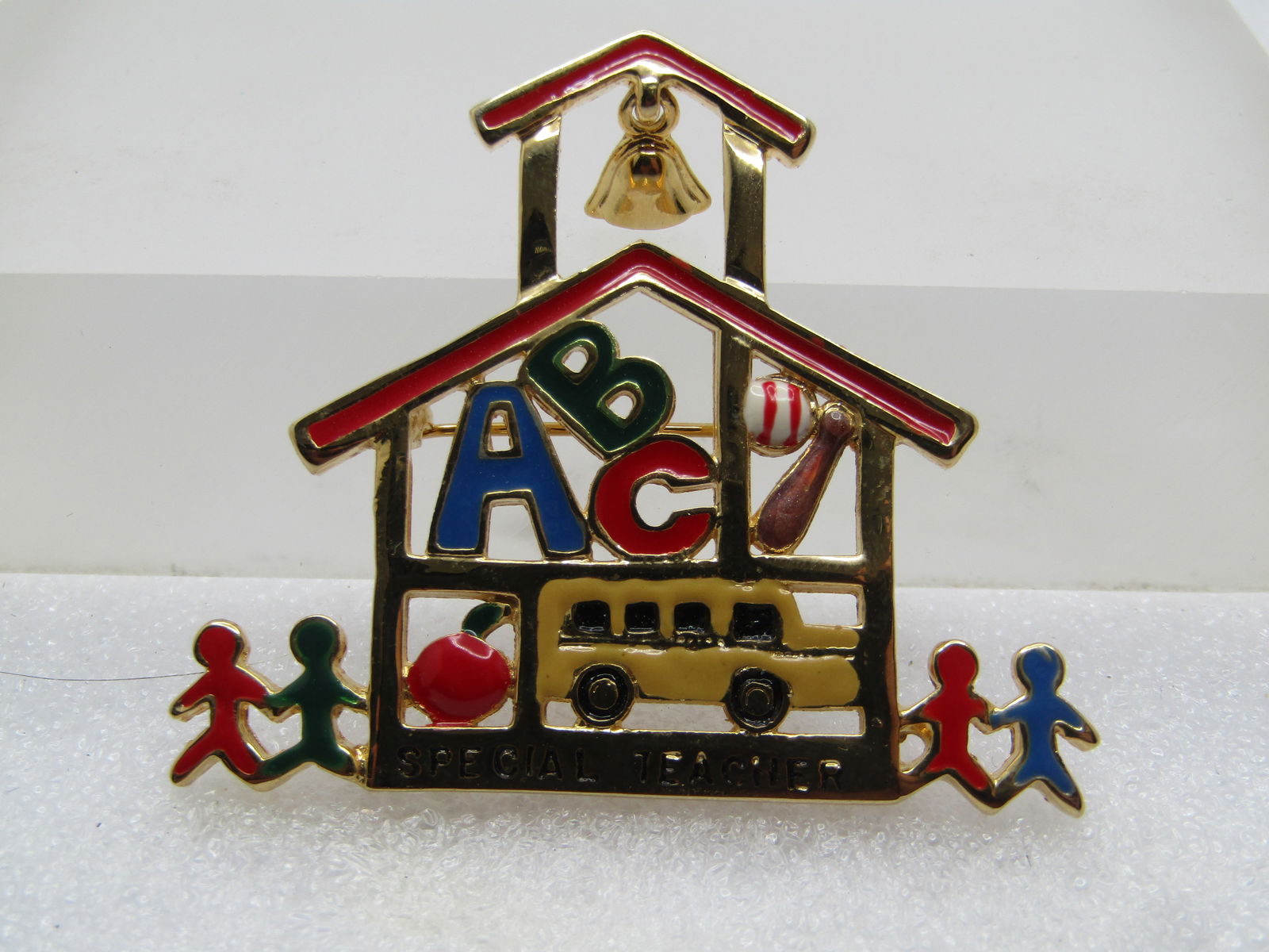 Vintage Special Teacher Enameled Brooch, Signed TC, 1980's-1990's: Vintage Special Teacher Enameled Brooch, Signed TC, 1980's-1990's. Tanya Creations School open framed broch with bell at top and enameled ABC in one opening; baseball bat and ball in another;