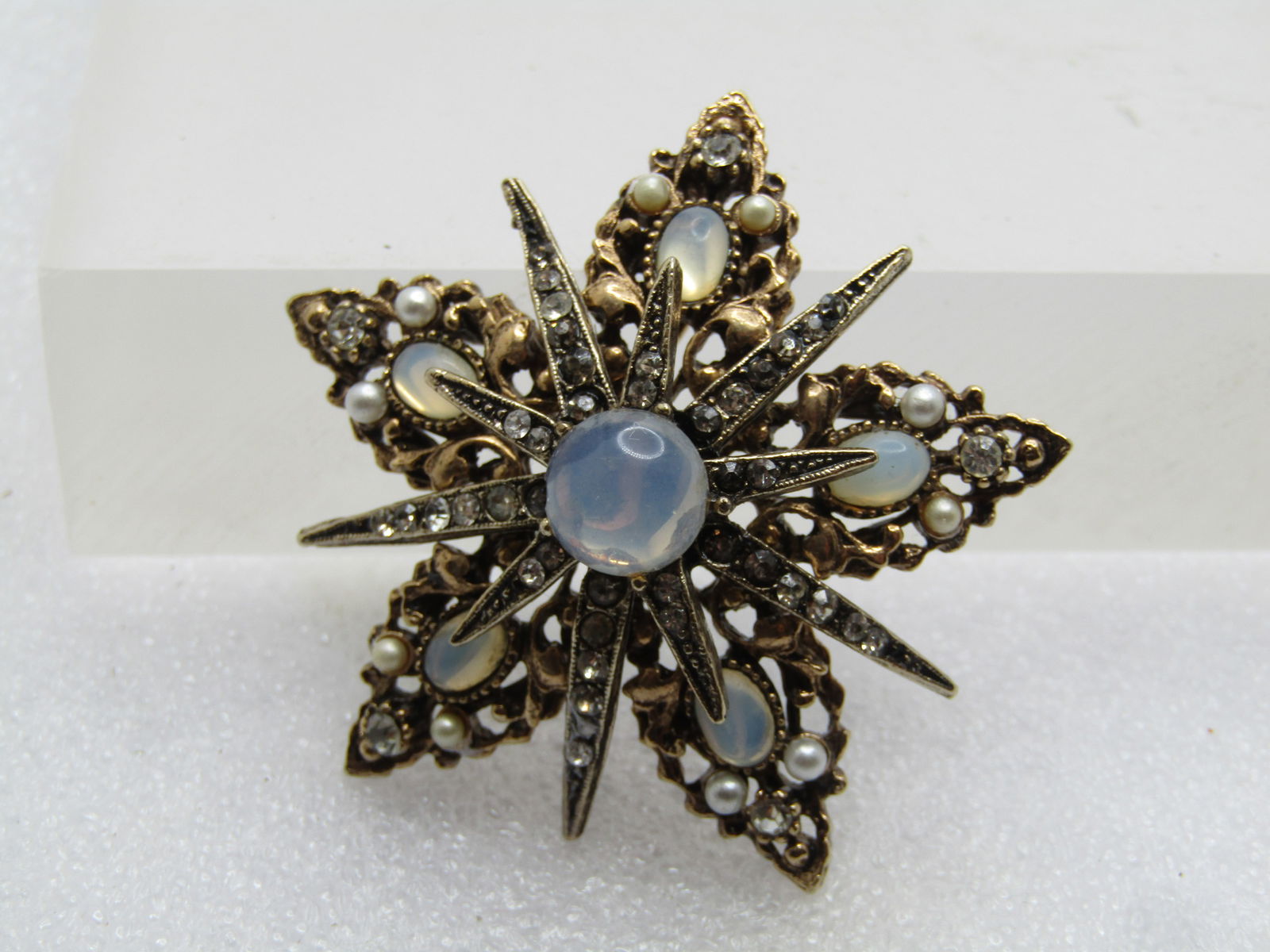 Vintage Faux Pearl, Rhinestone Star Brooch, Signed Art, 1960's: Vintage Faux Pearl, Rhinestone Star Brooch, Signed Art, 1960's. Three-toned tiered star that is appx. 2" across. The bottom tier is yellow gold toned. The top two tiers are silver toned. The main