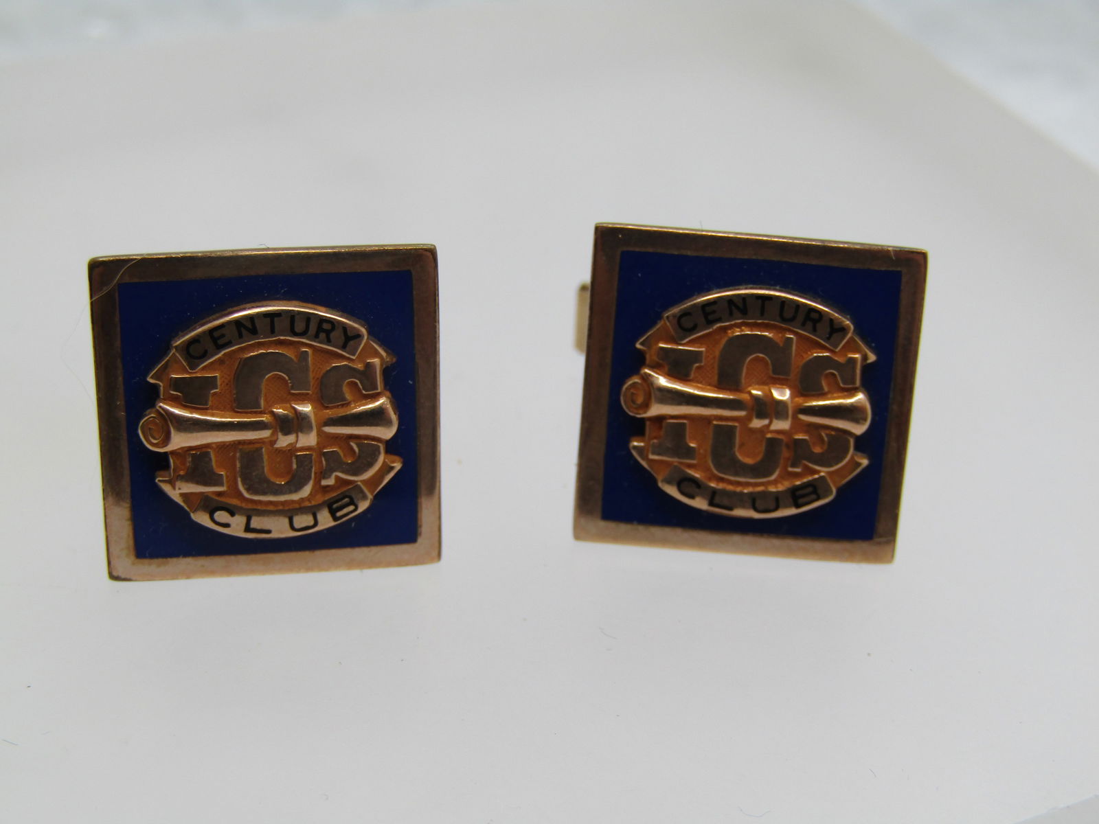 Vintage Century Club Cufflinks, Signed/Marked M1/10 10kt DP: Vintage Century Club Cufflinks, Signed/Marked M1/10 10kt DP on the back of the top of the cufflinks and marked 1/20 12kt G.F. on the swivel. 3/4" square with blue background and the Century Club emble