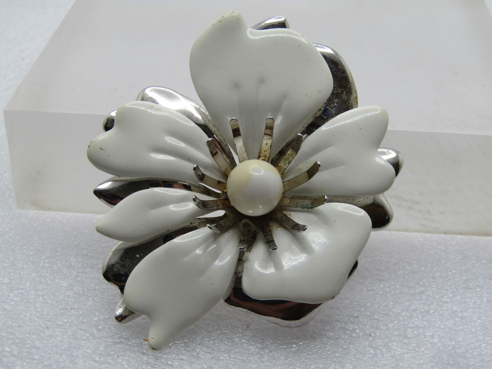 Vintage White Enameled Blossom Brooch, Sarah Coventry, 1960's-1970's: Vintage White Enameled Blossom Brooch, Sarah Coventry, 1960's-1970's. White enameled and silver tone mod style blossom brooch. It has long curved anthers that have an 9mm round white bead in the