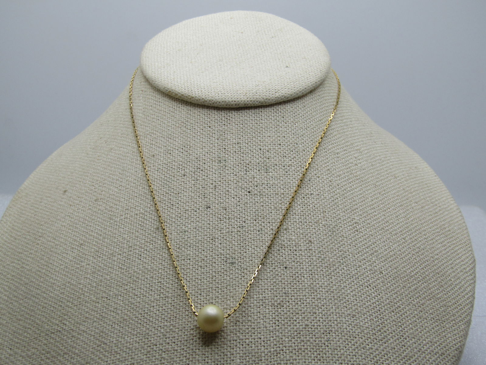 Vintage Napier Faux Pearl Necklace, 15", 1960's-1970's: Vintage Napier Faux Pearl Necklace, 15", 1960's-1970's. Gold tone chain that is a herringbone link that is appx. .08 mm wide with spring clasp and with a 7.5m faux pearl that slides on the chain. 