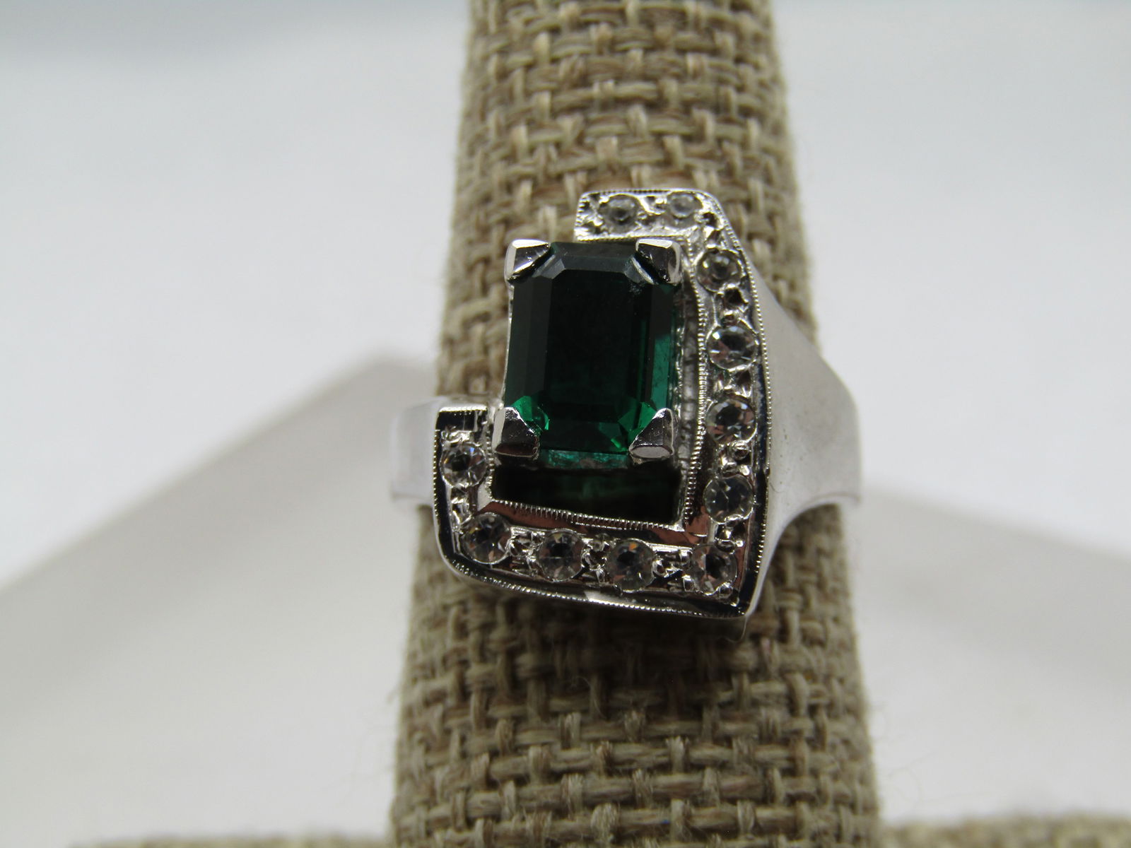 Vintage Emerald Green & Clear Rhinestone Ring, Sz. 7.25. 1990's: Vintage Emerald Green & Clear Rhinestone Ring, Sz. 7.25. 1990's silver tone costume ring. It is marked .925 and has a mark on the back of the band at the back of the finger. It has an art deco