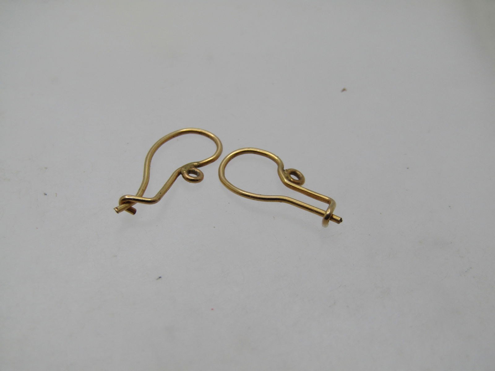 Vintage 10kt Earrings Hooks, Hand Made, 1960's-1970's: Vintage 10kt Earrings Hooks, Hand Made, 1960's-1970's or possibly earlier. These are 10kt yellow gold earings wires that have a looks in them - something can be hung from them or they can be worn as