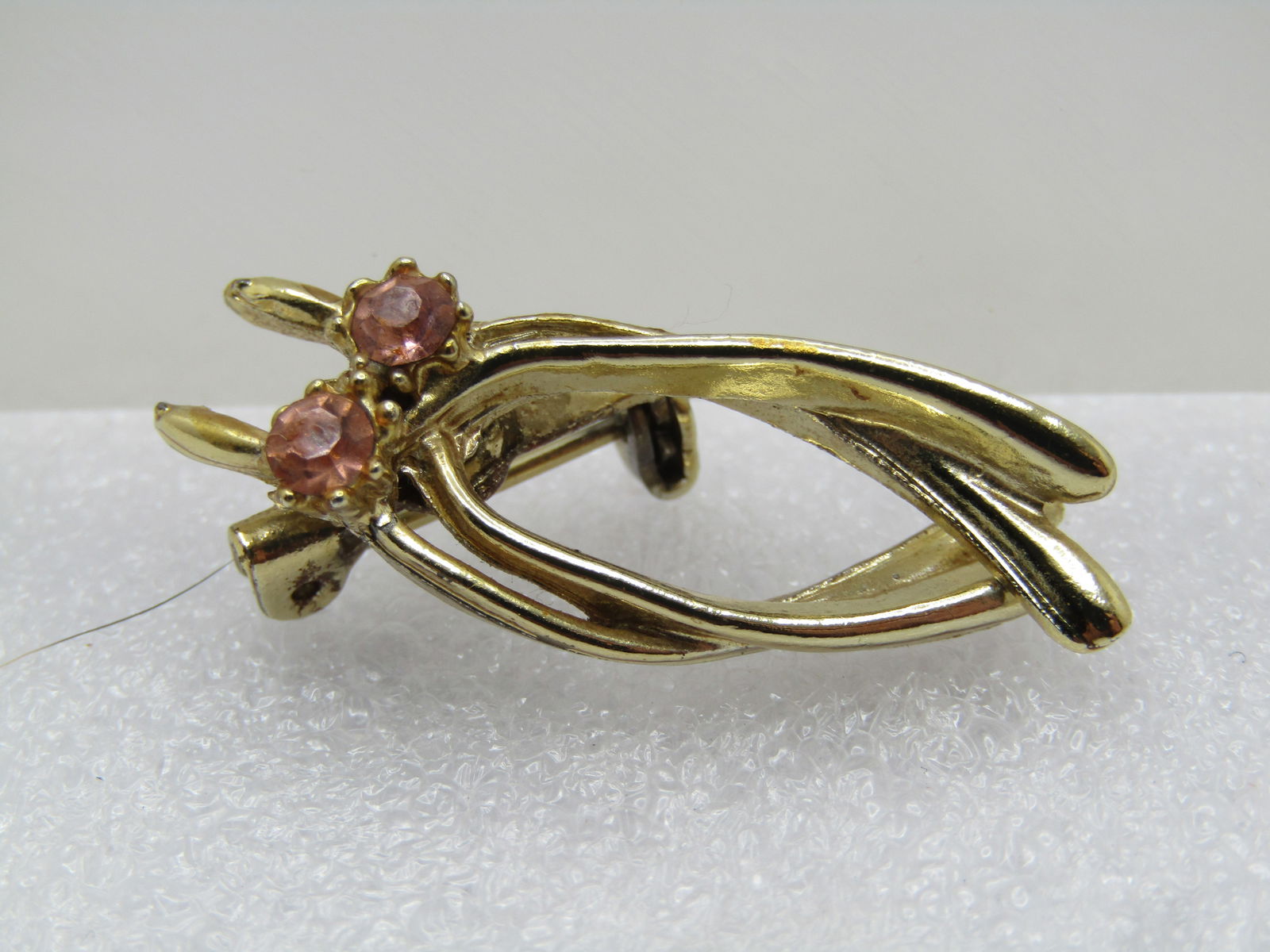 Vintage Double Wishbone Brooch, Pink Rhinestones, 1950's-1960's: Vintage Double Wishbone Brooch, Pink Rhinestones, 1950's-1960's. Good luck. Appx. 1.5" tall and 5/8" wide. Two overlapping wishbone brooches. Gold tone, locking clasp. Light wear. Good to very