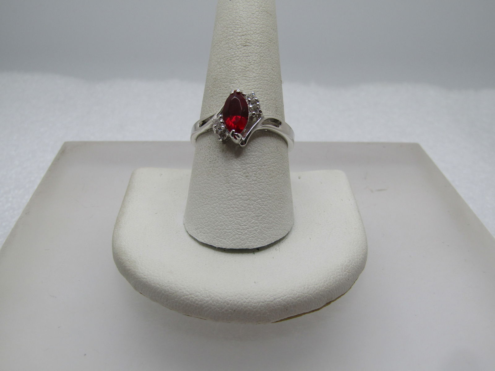 Vintage Red & Clear Stone Ring, Sz. 9.5, 1970's-1980's: Vintage Red & Clear Stone Ring, Sz. 9.5, 1970's-1980's. This has a red glass marquise stone and two clear stones on each side - one stone is set kind of wonky and priced accordingly. Silver tone with