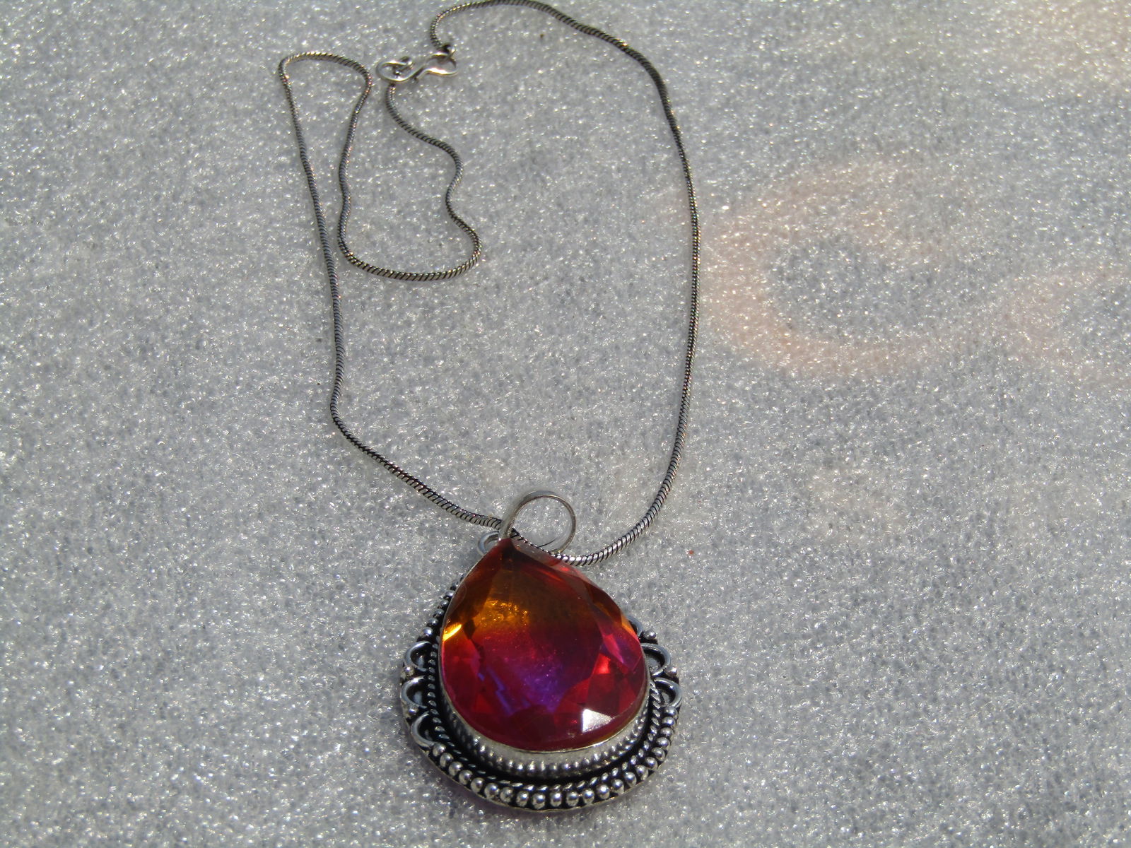 Simulated Ametrine Southwestern Themed Necklace, 19", Modern: Simulated Ametrine Southwestern Themed Necklace, 19", Modern costume piece with a large pear shaped glass faceted stone that is appx. 38.5mm by 24mm and bezel-set. The colors are very vibrant with 