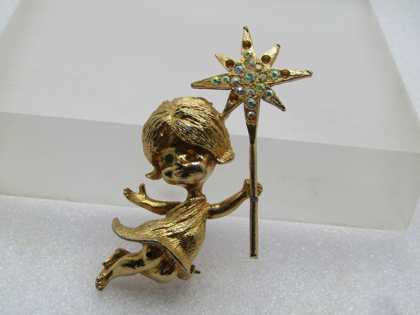 Vintage Girl Fairy AB Star Wand, Signed MYLU, 1960's: Vintage Girl Fairy AB Star Wand, Signed MYLU, 1960's. Gold tone with a a girl with aqua rhinestone rhinestone mostly AB rhinestones in the star wand she is holding. Appx. 2" tall and 1.5" wide. 