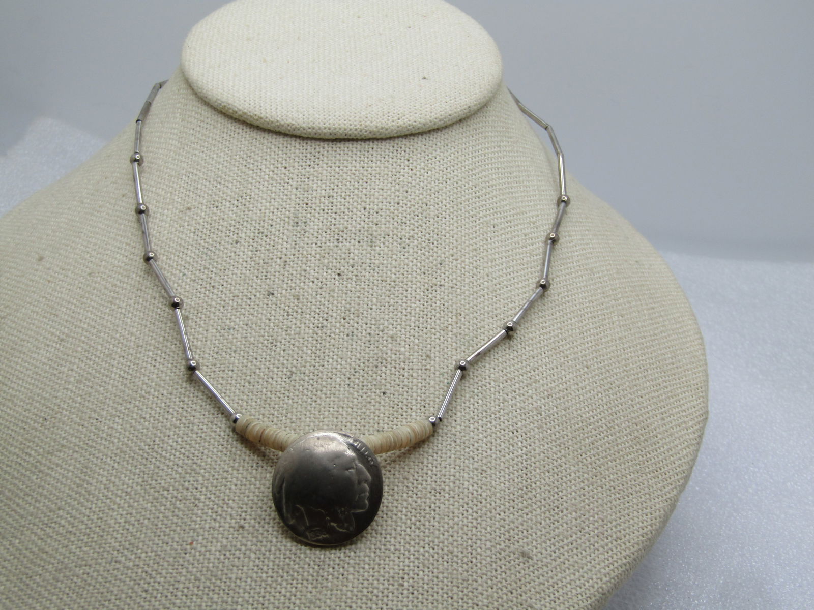 Vintage Heishi 1935 Buffalo Nickle Necklace, 16" - Southwestern, Unisex, 1970's: Vintage Heishi 1935 Buffalo Nickle Necklace, 16" - Unisex, 1970's. Southwestern, This has a doemd buffalo nickle as the pendant with an appx. 1" of white heishi beads on each side at front center