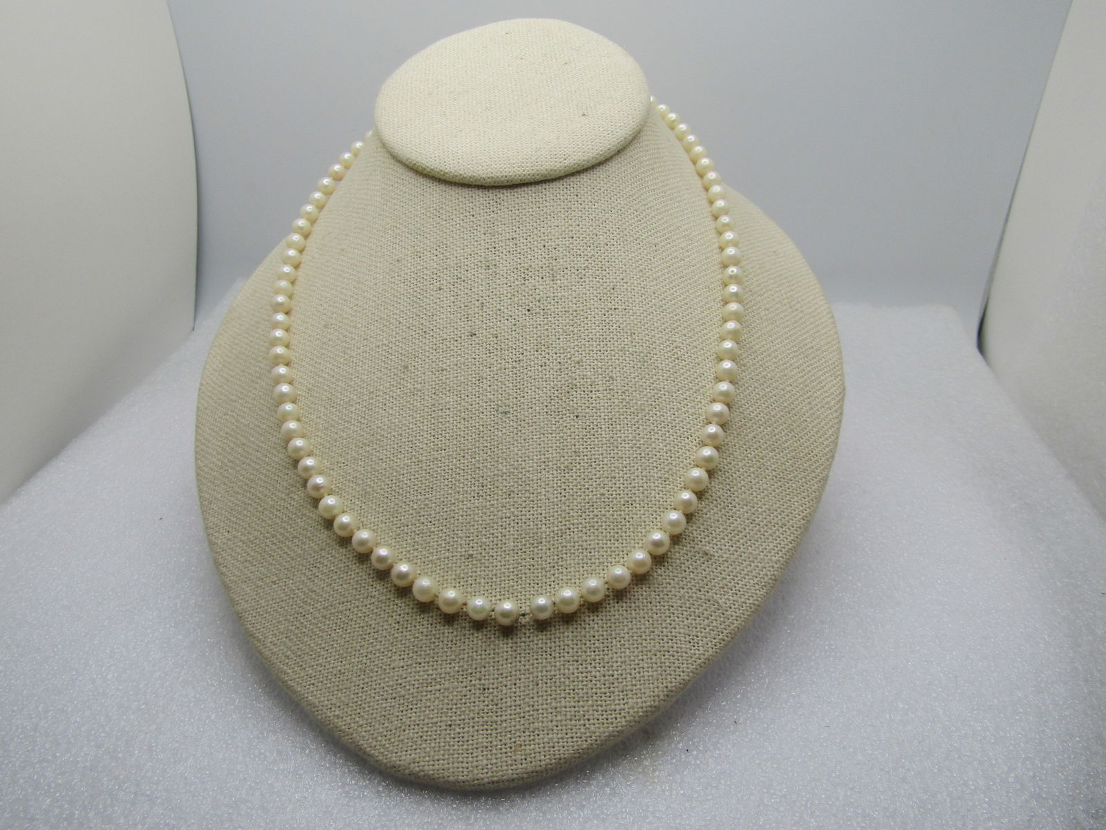 Vintage 5mm Faux Pearl Necklace, 18", 1960's-1970's,: Vintage 5mm Faux Pearl Necklace, 18", 1960's-1970's. Gold tone filigree box clasp that is cateye shaped. The pearls are knotted between each pearl. It is not signed or marked. Good to very good condit