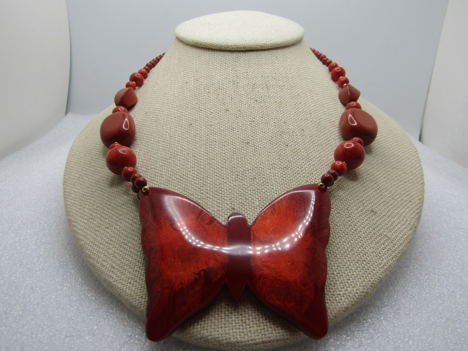 Vintage Butterfly Necklace, Lee Sands, 1980's, 18": Vintage Butterfly Necklace, Lee Sands, 1980's, 18". Shimmer orange to brick colored butterfly pendant at front that is appx. 2.5" wide and 2" tal. Laminated shimmery brick red and slightly domed