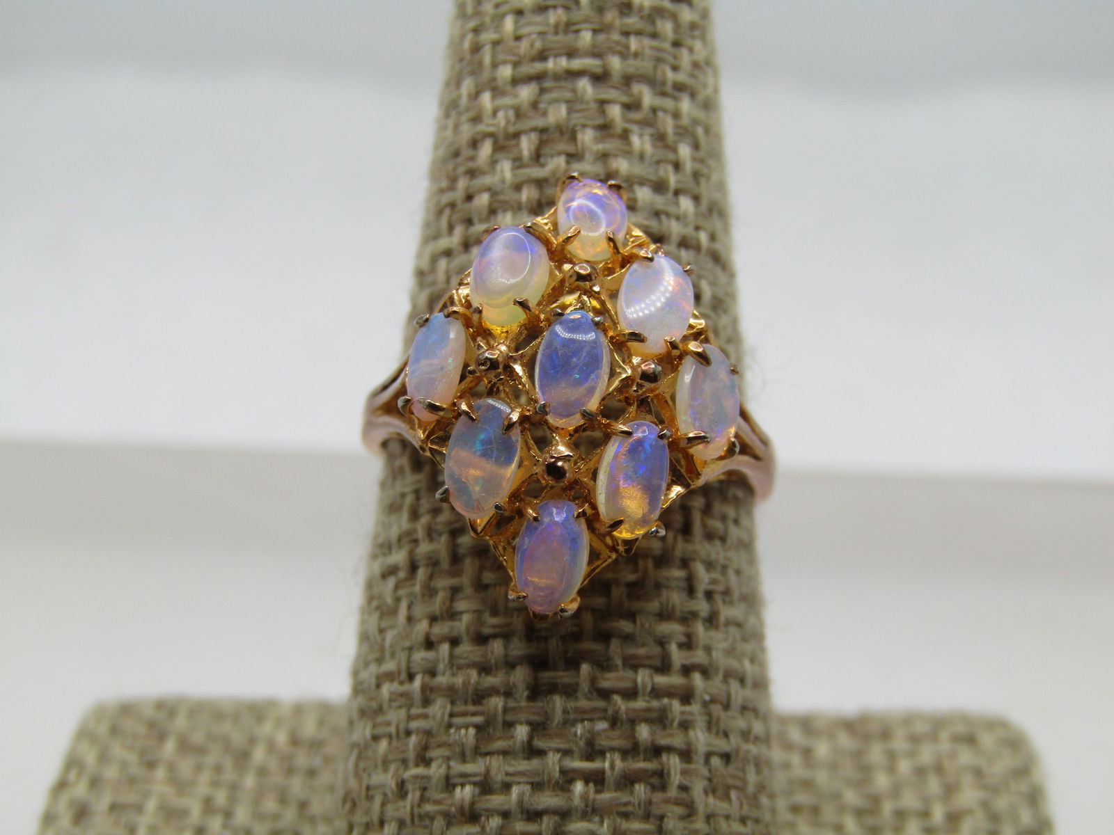 Vintage Faux Opal Cluster Ring, Sz.8.5 1980's-1990's: Vintage Faux Opal Cluster Ring, Sz.8.5 1980's-1990's. Gold tone with a large diamond shaped design with nine faux opals that are set in a domed design and each stone is appx. 5mm by 4mm. The ring