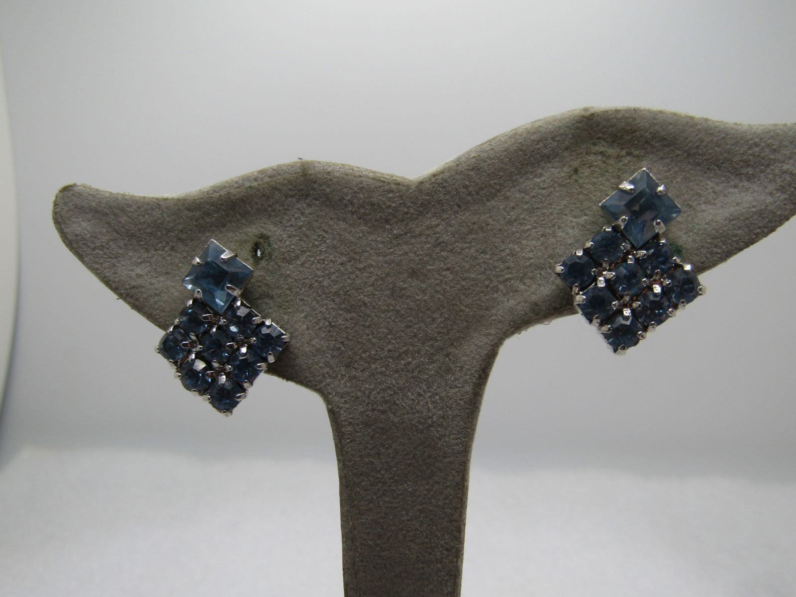 Vintage Blue Rhinestone Screwback Earrings, 1940's-1960's.: Vintage Blue Rhinestone Screwback Earrings, 1940's-1960's. Silver tone with a 6mm baby blue rhinestone set on the corner of an 11mm blue rhinestone square. They are appx. 3/4" tall and wide. They are