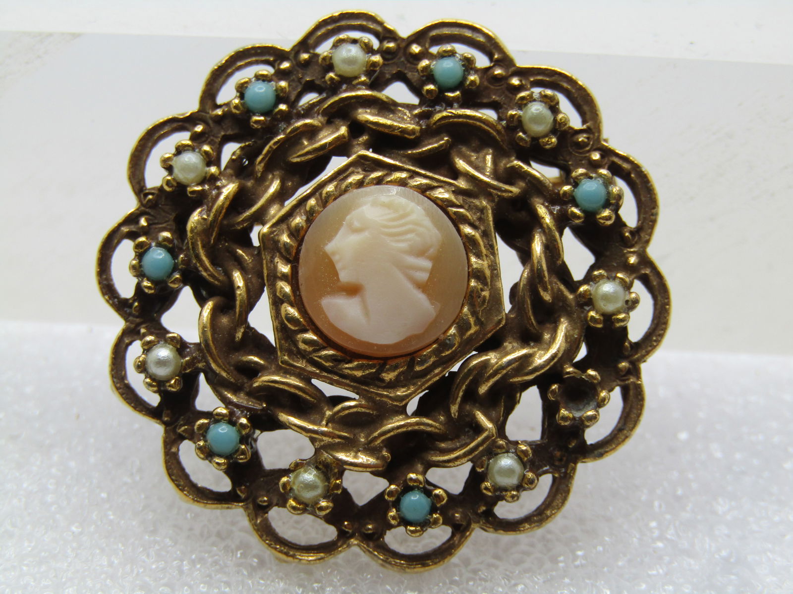 Vintage Cameo Brooch, Faux Turquoise & Pearl, Signed Gold Tone 1950's-1960's: Vintage Cameo Brooch, Faux Turquoise & Pearl, Signed Gold Tone 1950's-1960's, Gold tone with a center 1/3" round tan and white cameo, a twisted chain and rope frame around the cameo with alternating t