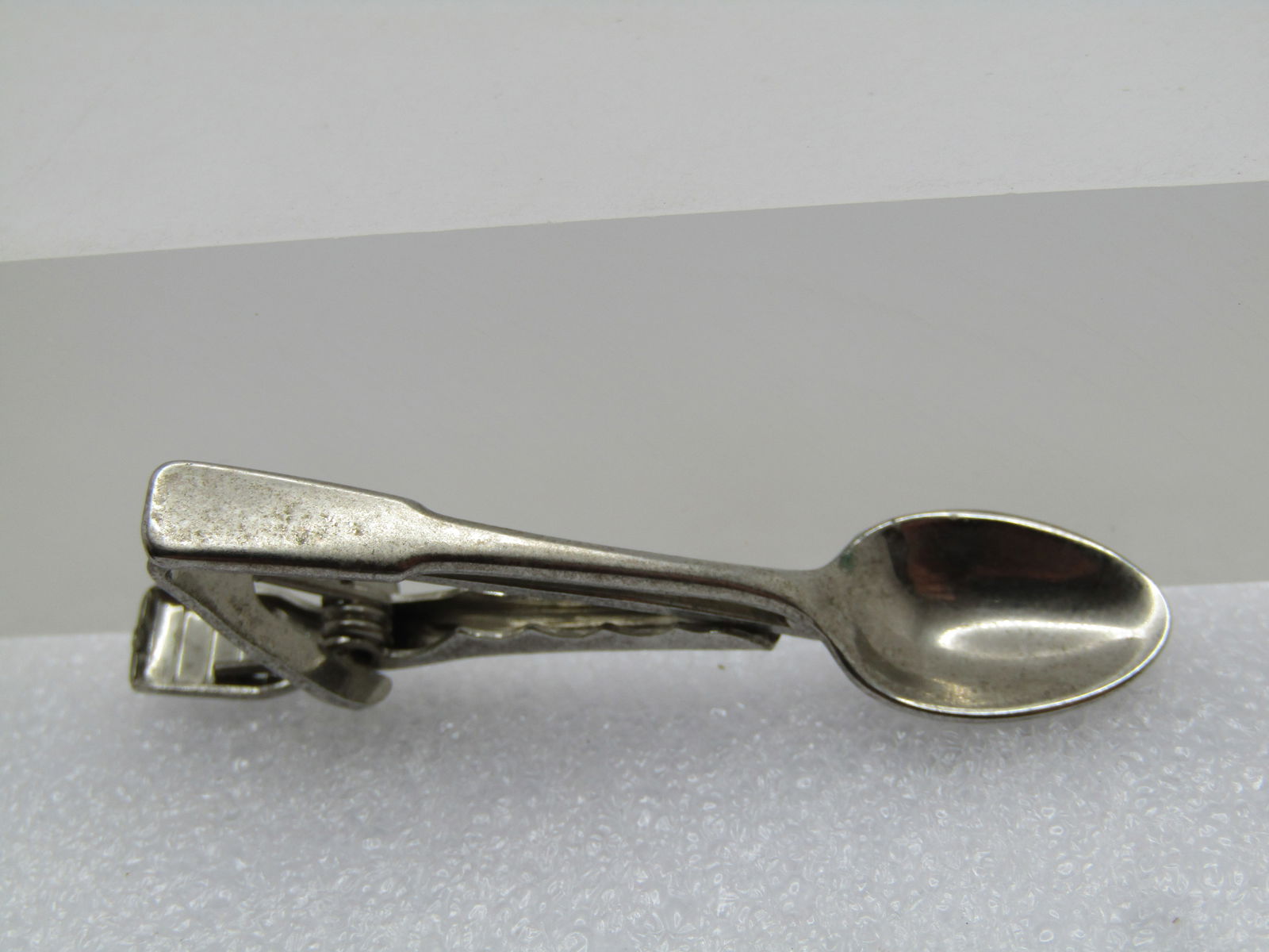 Vintage Spoon Tie Clasp, Signed Myers Co. 1960's: Vintage Spoon Tie Clasp, Signed Myers Co. 1960's. Silver tone and appx. 1-7/8" long and appx. 1/3" wide at the spoon bowl. It is signed Meyers Co and Wallingford, CT. Very good condition and very