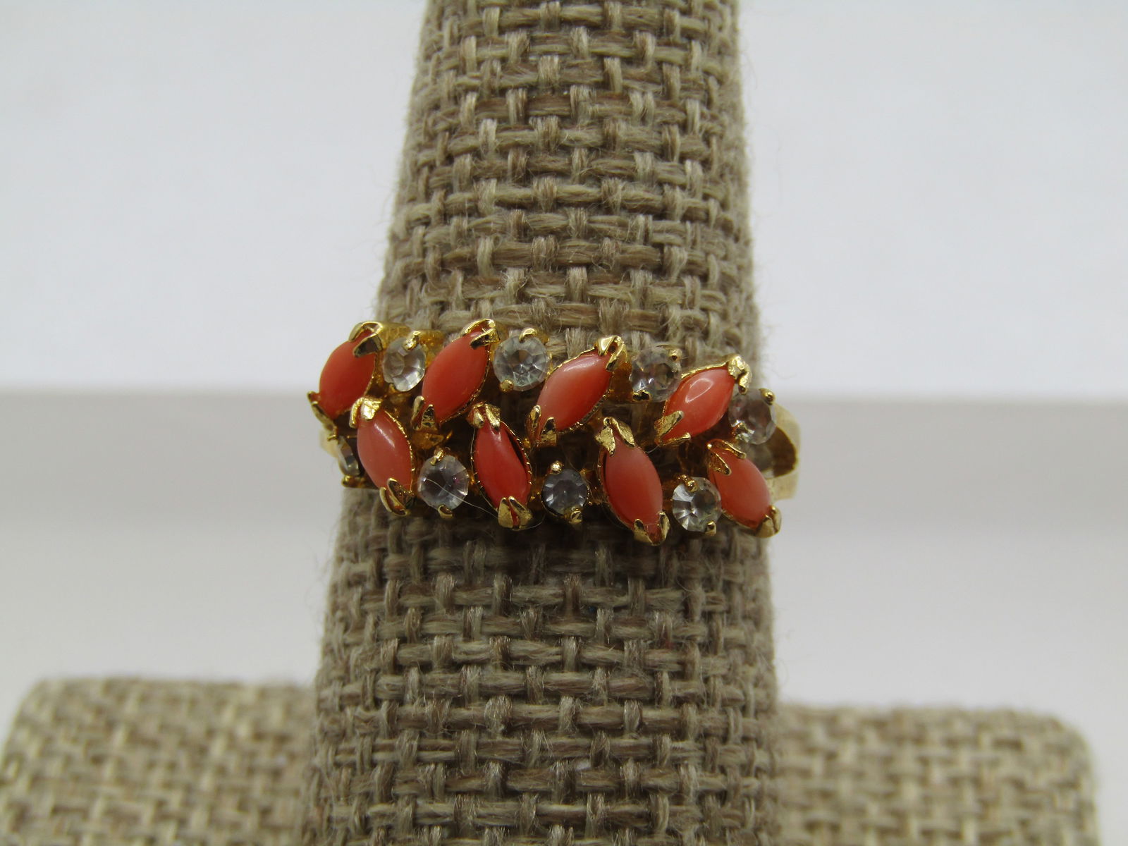 Vintage Faux Coral & Rhinestone Ring, Sz. 8.75, 1970's: Vintage Faux Coral & Rhinestone Ring, Sz. 8.75, 1970's. Very pretty ring alternating marquise shaped faux pink coral stones that are appx. 3.5mm by 2mm alternating with clear round rhinestones that
