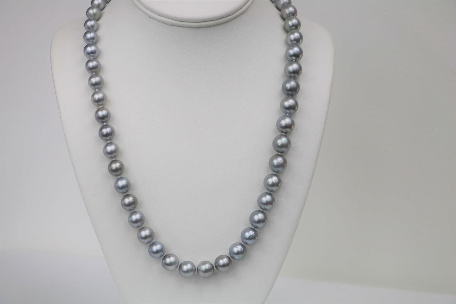 10-12mm Tahitain Platinum Silver Round Long Necklace with 14k Clasp: Title:10-12mm Tahitain Platinum Silver Round Long Necklace with 14k ClaspDescription:AAA Luster, Tahitian Silver Platinum Necklace, 50 pearl pieces, 22 inches hand knotted with 14k white-gold