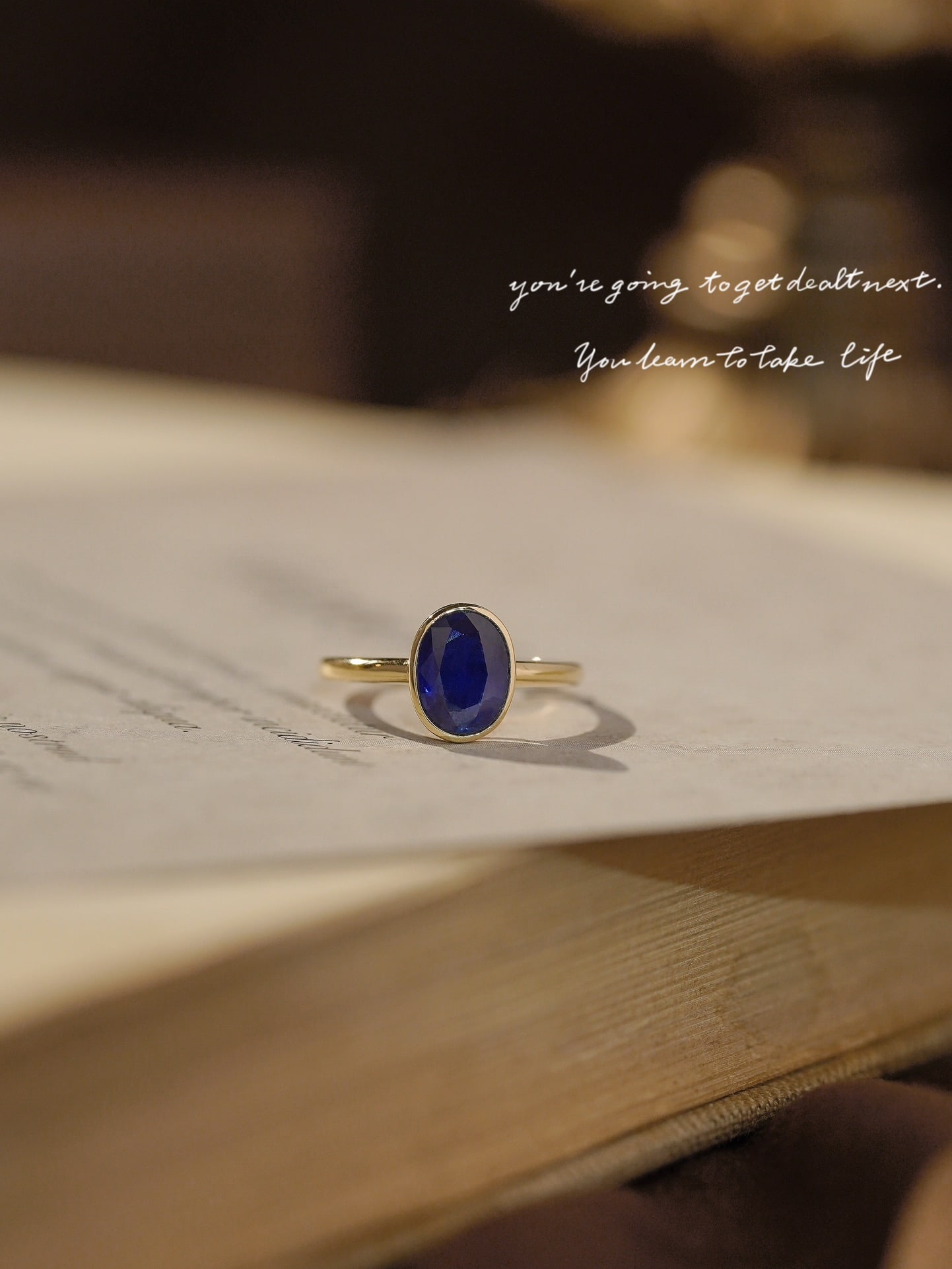 18k Sapphire Ring: Title: 18k Sapphire Ring Description: This sapphire ring captures the essence of elegance with its simple yet noble design. The deep royal blue sapphire is set in 18k gold, creating a timeless piece