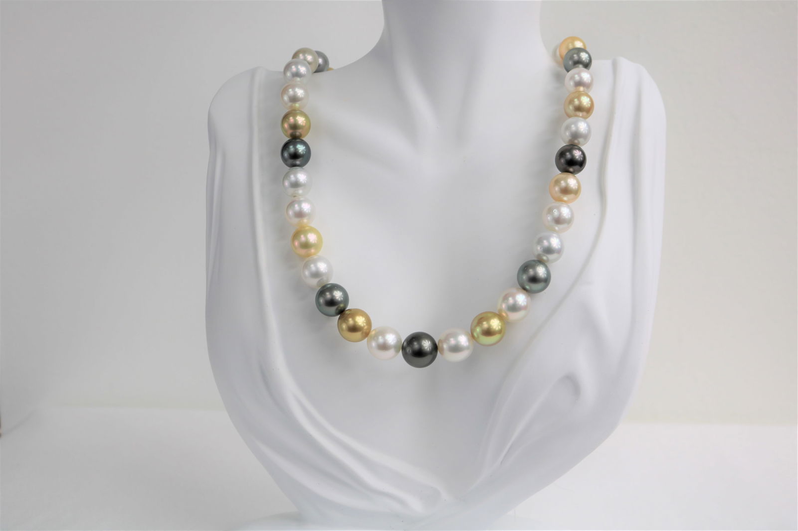 10-12mm Golden South Sea and Tahitian Multi Color Round Necklace with 14k Clasp: Title:10-12mm Golden South Sea and Tahitian Multi Color Round Necklace with 14k ClaspDescription:AAA Quality Pearls, AAA Luster, Round/Near Round, 37 pearl pieces, 18 inches hand knotted with 14k YG