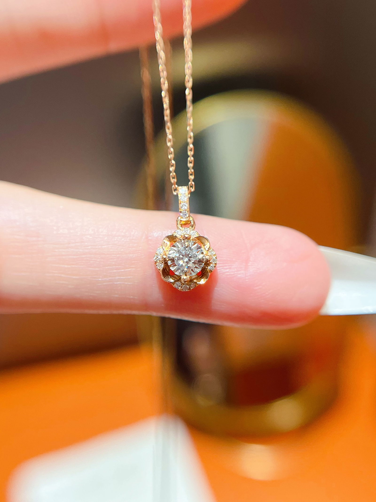 18k Diamond Pendant: Title: 18k Diamond Pendant Description: This pendant captures the essence of elegance with its exquisite design, and the embedded diamonds shimmer with a captivating brilliance with every movement. Th