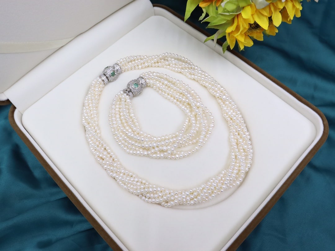 Natural freshwater pearl necklace and bracelet set: Title: Natural freshwater pearl necklace and bracelet set Description: This multi-layer twisted necklace set showcases timeless elegance and modern delicacy. The natural freshwater pearls are around
