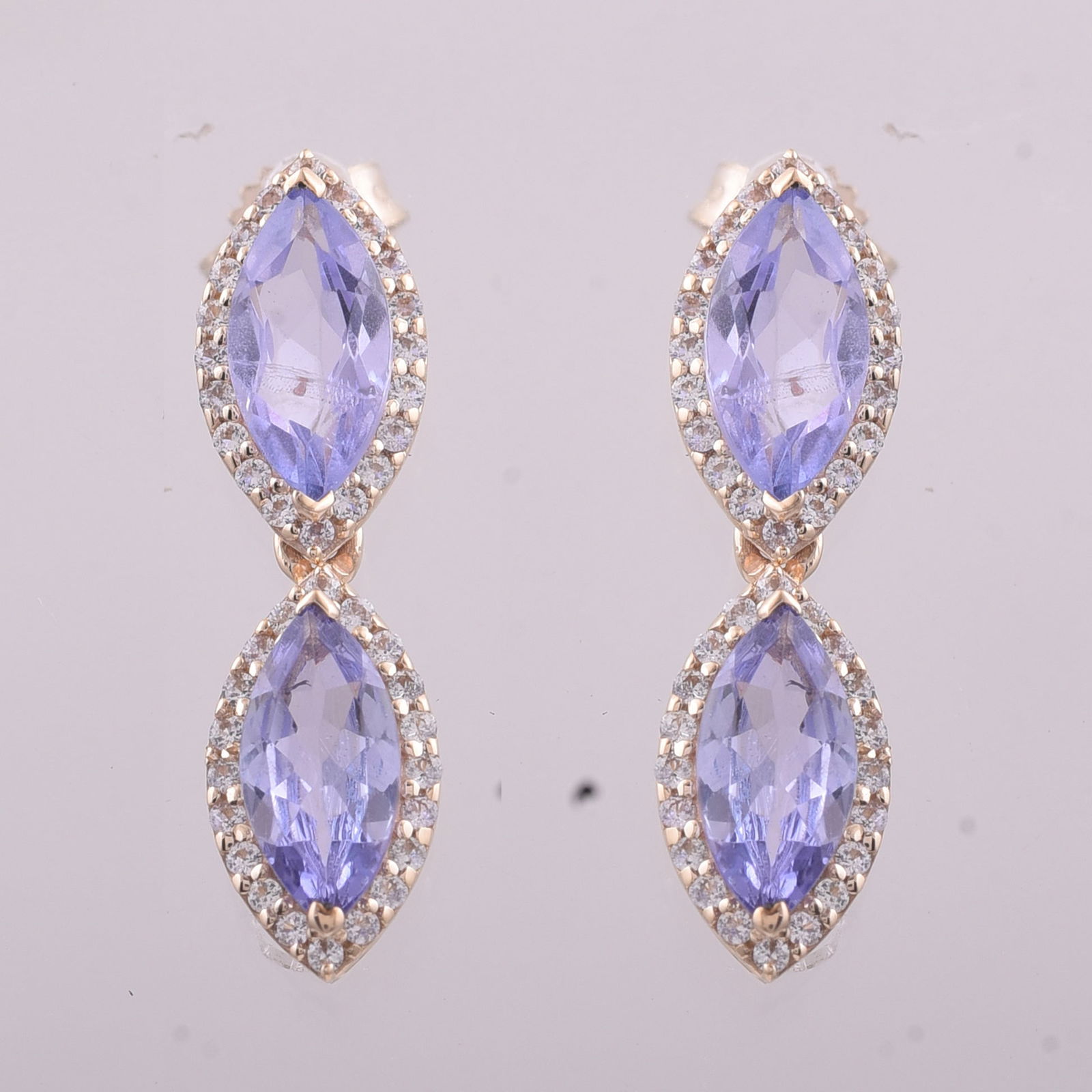 2.34 Ct Marquise Tanzanite 9K Gold Earrings: 2.34 Total Carat Tanzanite 9K Gold Earrings Specifications - Total Weight 2.132 g - Center Gemstone Tanzanite - Gemstone Carat Weight 1.95 Carats - Gemstone Measurements 8X4 mm - Additional Gemstones