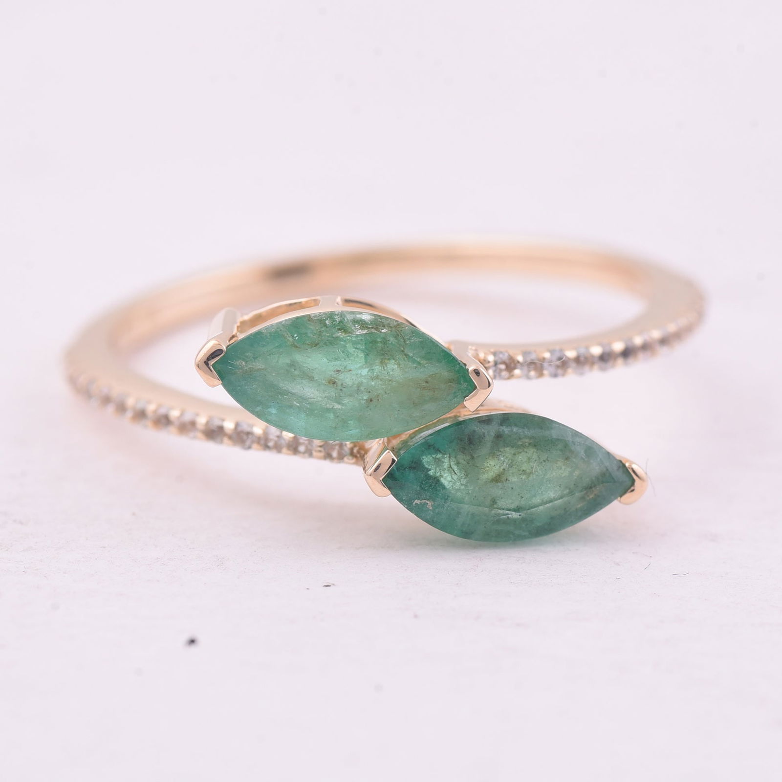 1.20 Ct Marquise Emerald 9K Gold Ring: 1.20 Total Carat Emerald 9K Gold Ring Specifications - Total Weight 1.503 g - Center Gemstone Emerald - Gemstone Carat Weight 1.07 Carats - Gemstone Measurements 8X4 mm - Additional Gemstones White