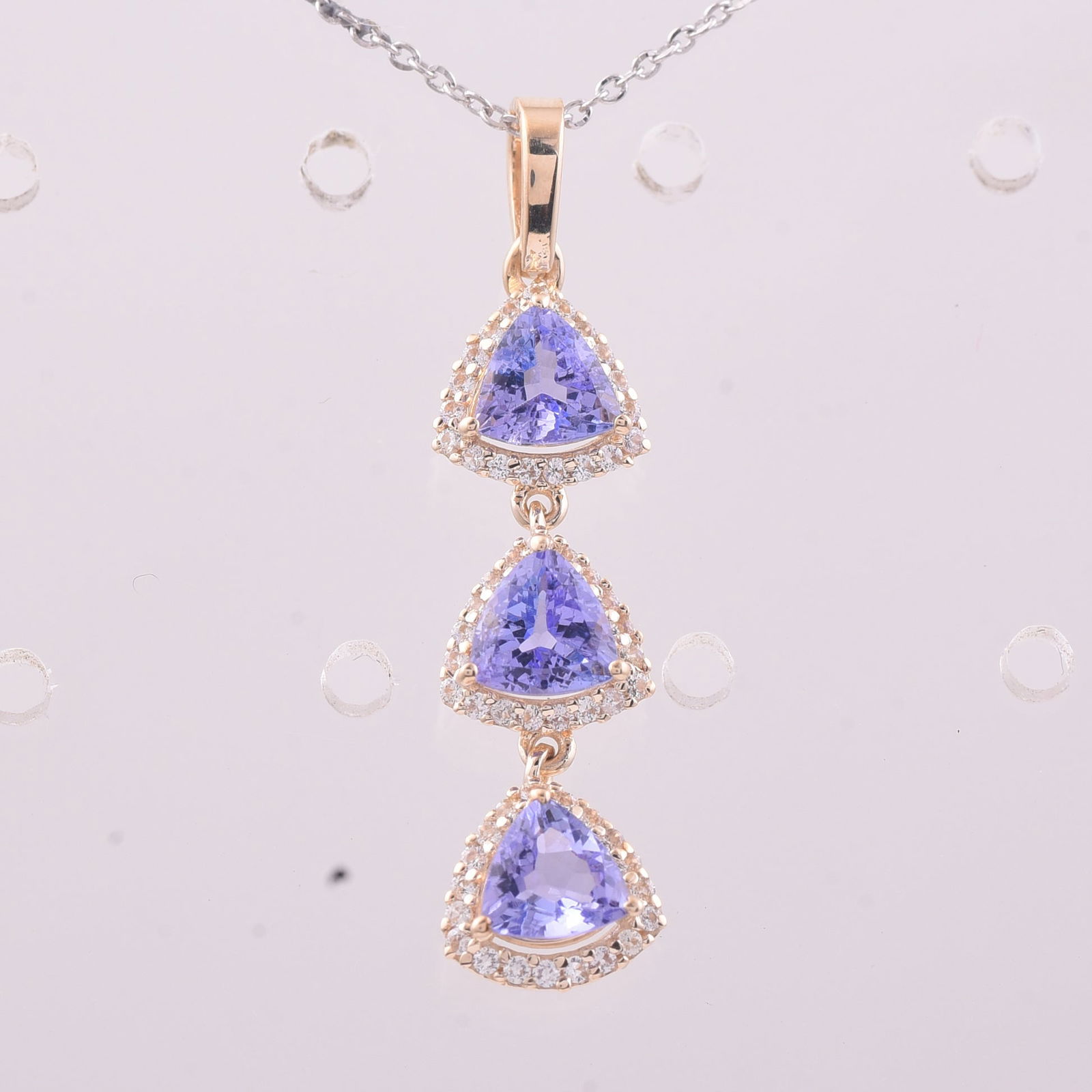 1.59 Ct Trillion Tanzanite 9K Gold Pendant: 1.59 Total Carat Tanzanite 9K Gold Pendant Specifications - Total Weight 1.389 g - Center Gemstone Tanzanite - Gemstone Carat Weight 1.36 Carats - Gemstone Measurements 5X5 mm - Additional Gemstones