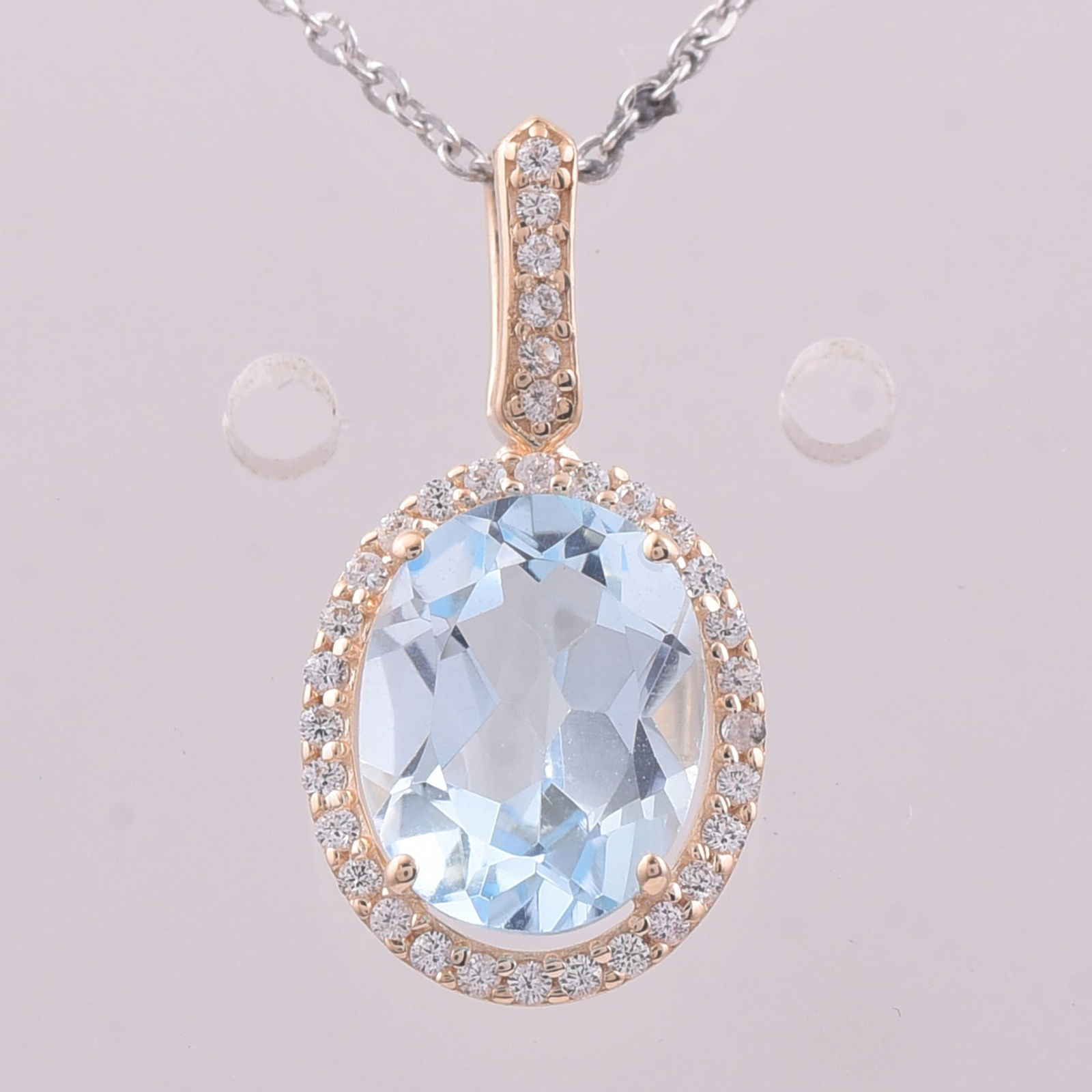 2.26 Ct Oval Blue Topaz 9K Gold Pendant: 2.26 Total Carat Blue Topaz 9K Gold Pendant Specifications - Total Weight 1.147 g - Center Gemstone Blue Topaz - Gemstone Carat Weight 2.11 Carats - Gemstone Measurements 9X7 mm - Additional Gemstones
