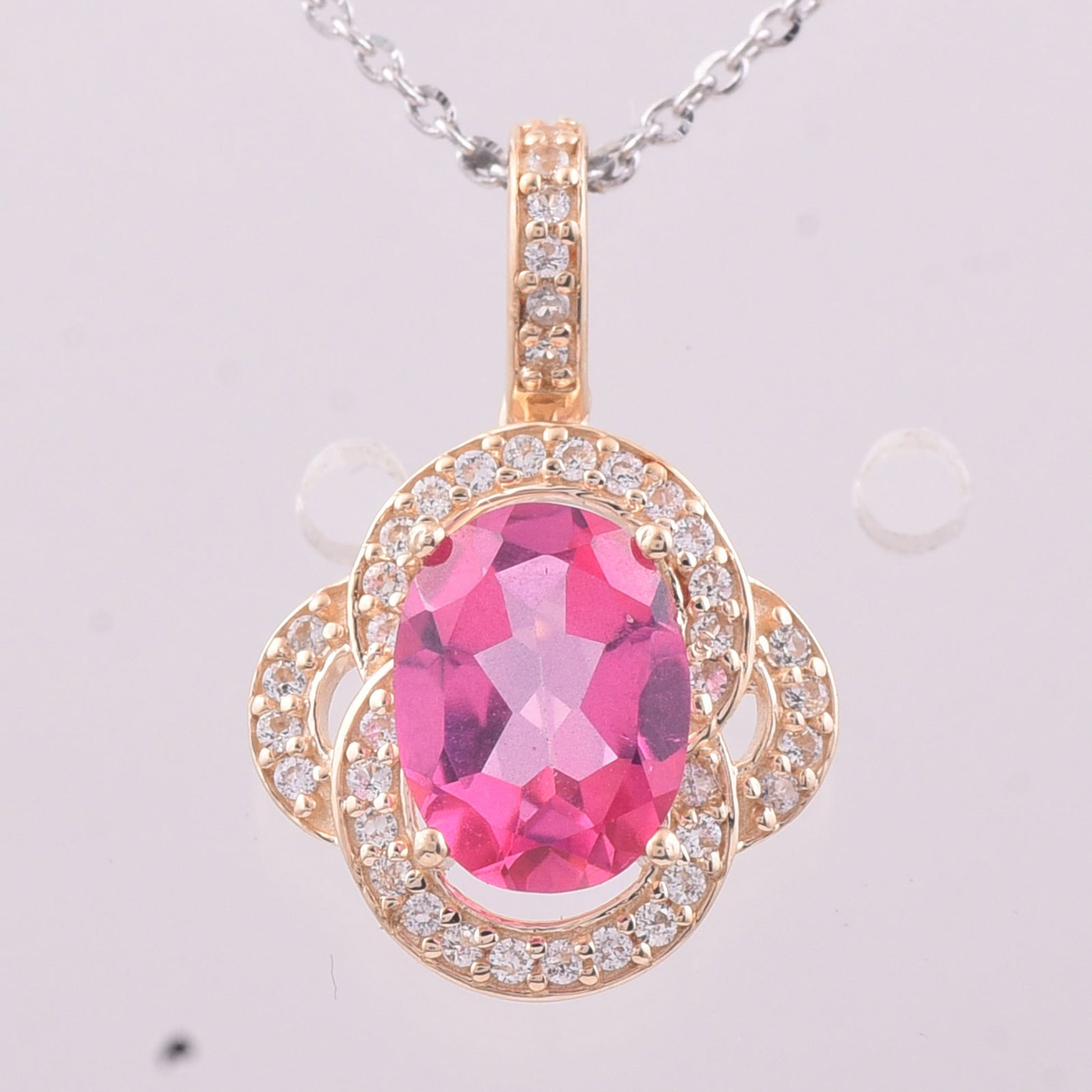 1.53 Ct Oval Pink Topaz 9K Gold Pendant: 1.53 Total Carat Pink Topaz 9K Gold Pendant Specifications - Total Weight 1.289 g - Center Gemstone Pink Topaz - Gemstone Carat Weight 1.35 Carats - Gemstone Measurements 8X6 mm - Additional Gemstones