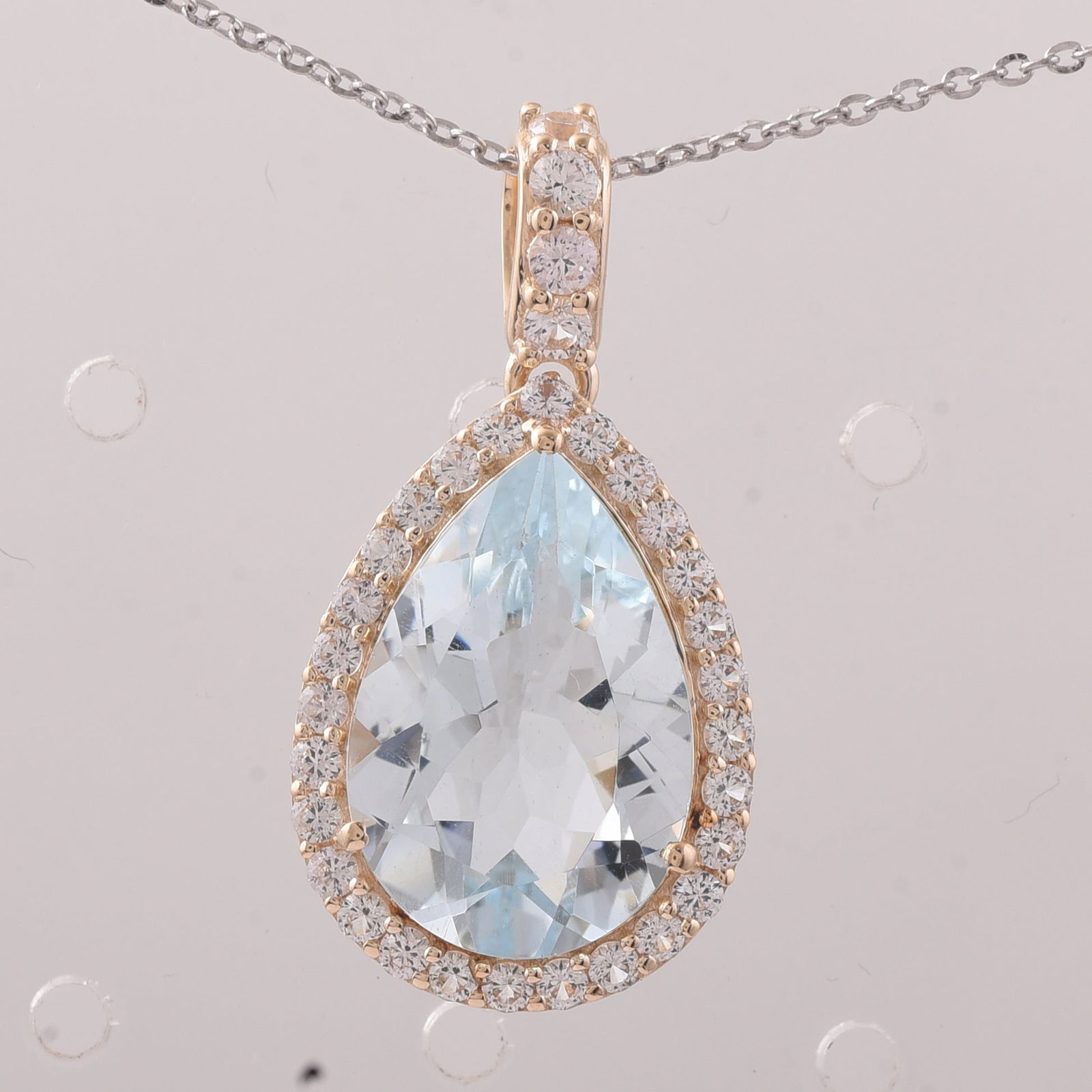 5.49 Ct Pear Aquamarine 9K Gold Pendant: 5.49 Total Carat Aquamarine 9K Gold Pendant Specifications - Total Weight 2.209 g - Center Gemstone Aquamarine - Gemstone Carat Weight 4.8 Carats - Gemstone Measurements 15.10X10.20X6 mm - Additional