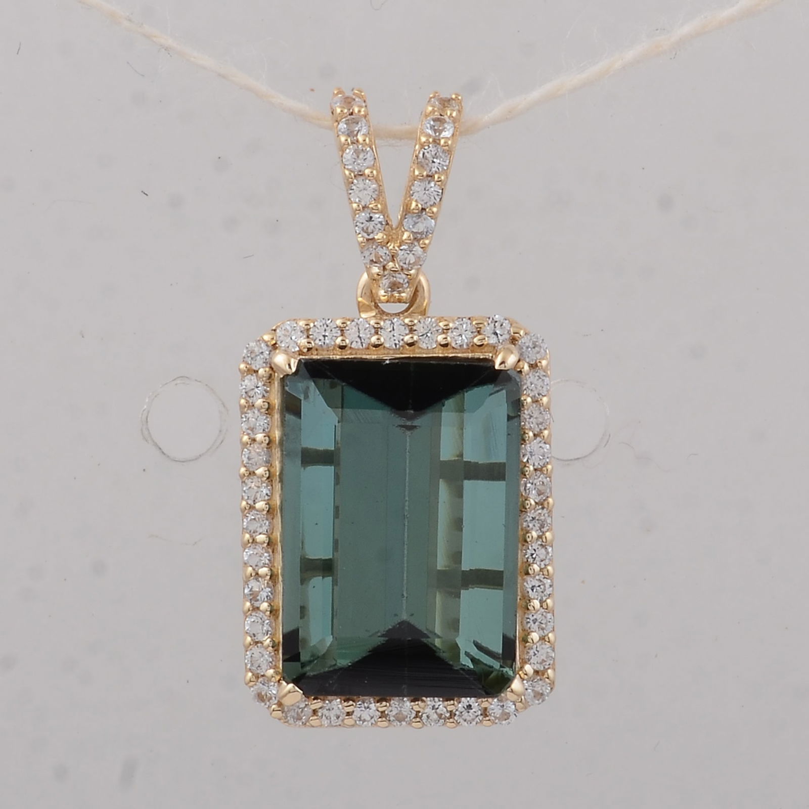 3.19 Ct Octagon Tourmaline 9K Gold Pendant: 3.19 Total Carat Tourmaline 9K Gold Pendant Specifications - Total Weight 1.54 g - Center Gemstone Tourmaline - Gemstone Carat Weight 2.97 Carats - Gemstone Measurements 10X7X5 mm - Additional