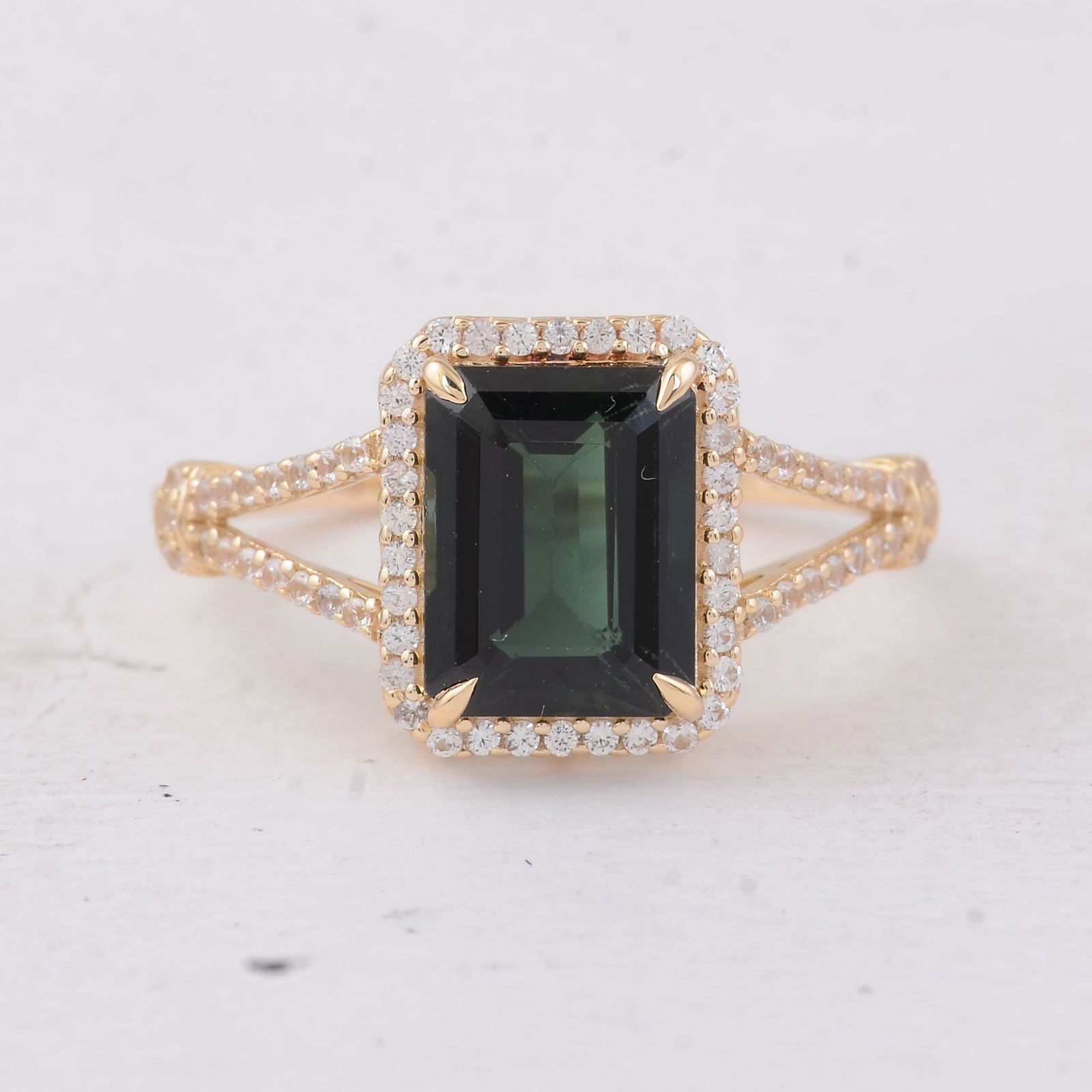 2.91 Ct Octagon Tourmaline 9K Gold Ring: 2.91 Total Carat Tourmaline 9K Gold Ring Specifications - Total Weight 2.401 g - Center Gemstone Tourmaline - Gemstone Carat Weight 2.59 Carats - Gemstone Measurements 9X7X4.70 mm - Additional Gemston