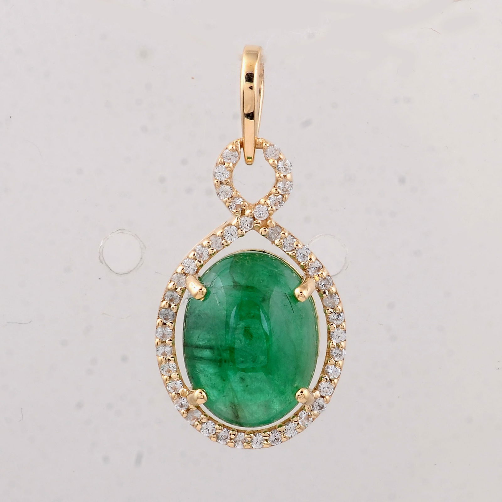 2.95 Ct Oval Emerald 9K Gold Pendant: 2.95 Total Carat Emerald 9K Gold Pendant Specifications - Total Weight 1.39 g - Center Gemstone Emerald - Gemstone Carat Weight 2.78 Carats - Gemstone Measurements 10X7.70X5 mm - Additional Gemstones