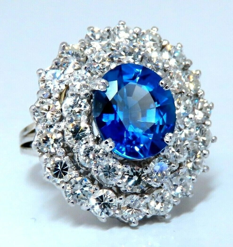 GIA Certified 3.55ct Natural No Heat Blue Sapphire Cocktail Cluster Ring 18kt: Title: GIA Certified 3.55ct Natural No Heat Blue Sapphire Cocktail Cluster Ring 18kt Description: Classic Cocktail Raised Cluster 3.55ct. Natural GIA Certified Blue Sapphire Ring GIA Certified Report