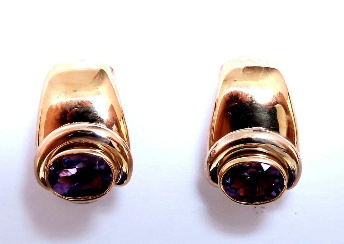 2ct natural oval purple amethyst clip earrings 18kt**: Title: 2ct natural oval purple amethyst clip earrings 18kt** Description: Natural Vivid Purple Amethyst Clip Earrings. 2ct natural vivid purple amethyst. 7x5 mm each 18 karat yellow gold 8.2 grams Ove