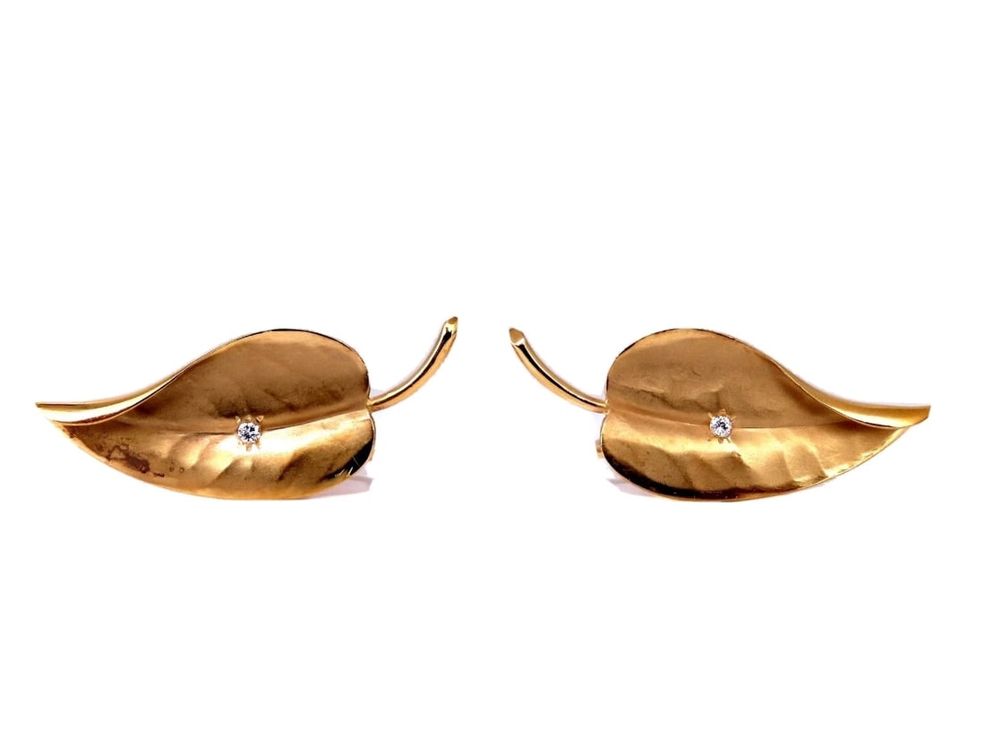 .36ct. natural round diamond 3d leaf pattern earrings 14kt non pierced**: Title: .36ct. natural round diamond 3d leaf pattern earrings 14kt non pierced** Description: Leaf shape diamond earrings. .36 carat natural round diamonds G color vs2 clarity 14kt yellow gold 5.8