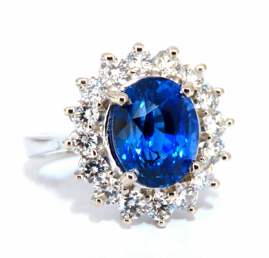 GIA Certified 4.08ct Natural Madagascar Sapphire Diamond Ring 14 Karat: Title: GIA Certified 4.08ct Natural Madagascar Sapphire Diamond Ring 14 Karat Description: Classic Halo Cluster GIA Certified 4.05ct. Natural Madagascar Blue Sapphire ring. Report: 5211431444 Oval cut