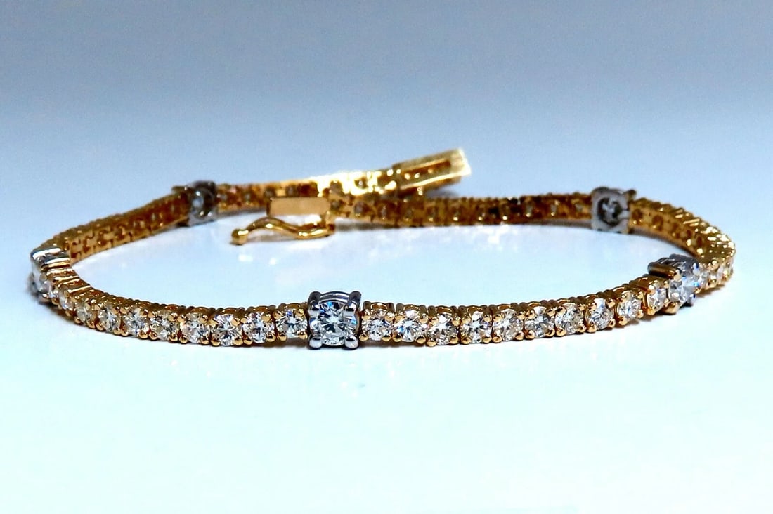 4.51ct Natural Diamonds Tennis Bracelet 14kt Gold Classic Station Alternate**: Title: 4.51ct Natural Diamonds Tennis Bracelet 14kt Gold Classic Station Alternate** Description: Classic Tennis & Station Alternate Total 4.51ct. Natural diamonds bracelet. .96ct. 5 Round Diamonds, H