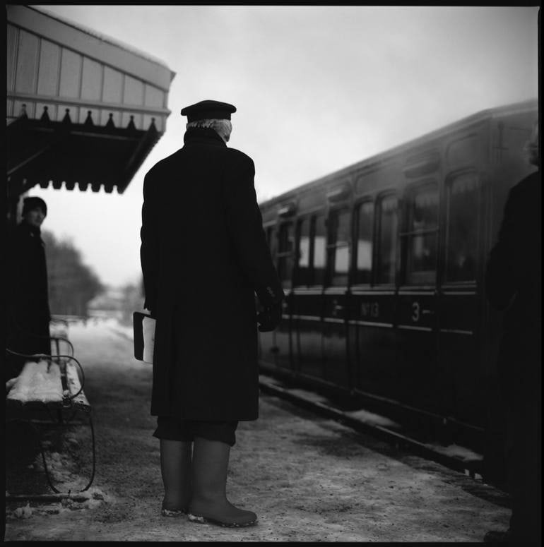 Edition 2/10 - Railway Guard, Mid-Suffolk Light Railway, Suffolk: Title: Edition 2/10 - Railway Guard, Mid-Suffolk Light Railway, Suffolk Photograph Artist: Paul Cooklin Origin: United Kingdom Medium: Photography, Gelatin on Paper Dimensions: 16 W x 20 H x 0.1 D in
