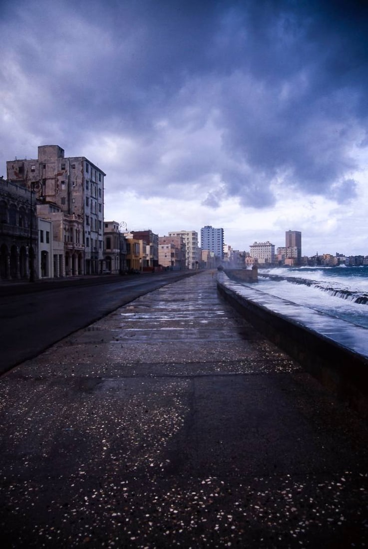 Dramatic Sky, The Malecon, Old Havana, Cuba - C Type: Title: Dramatic Sky, The Malecon, Old Havana, Cuba - C Type Photograph - Limited Edition of 10 Artist: Paul Cooklin Origin: United Kingdom Medium: Photography, Color on Paper Dimensions: 16 W x 20 H x