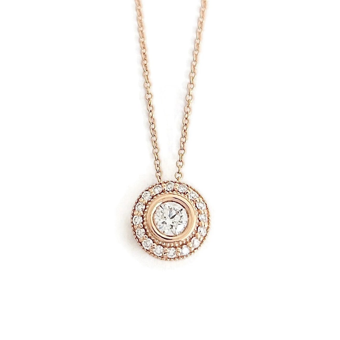 Round Diamond Bezel Halo Pendant Necklace 14K Pink Rose Gold, .52 CTW: Title: Round Diamond Bezel Halo Pendant Necklace 14K Pink Rose Gold, .52 CTW Description: Round Diamond Bezel Halo Pendant Necklace 14K Pink Rose Gold, .52 CTW This is a gorgeous classic diamond neckl