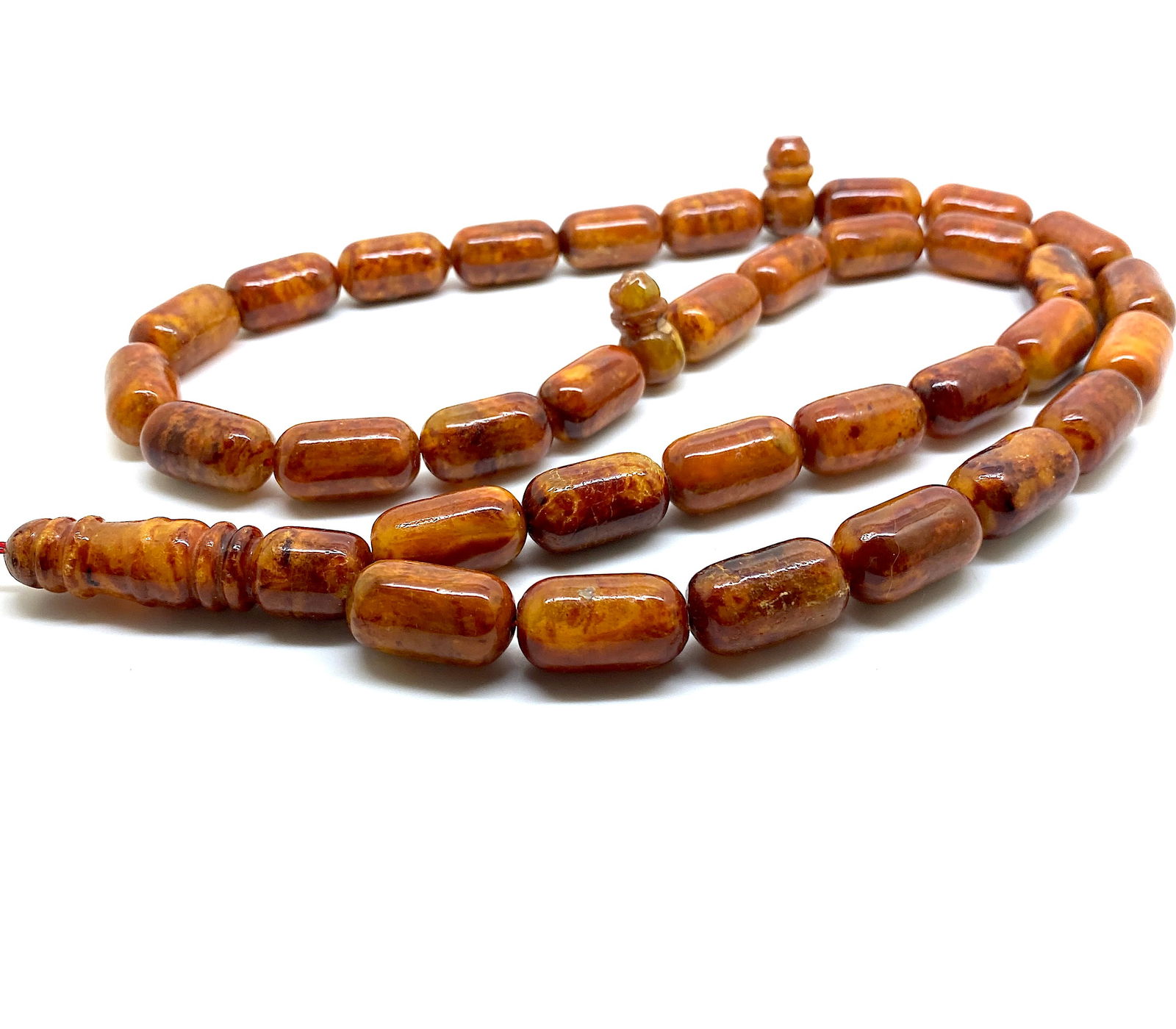 Marvellous Amber Tesbih made from Barrel shaped Amber beads: Title:Marvellous Amber Tesbih made from Barrel shaped Amber beads Metal:None Gemstone:Amber Weight:63.5 g Size:Bead size: 20.0 x 11.0 mm Bead size: 0.787 x 0.433 inches Made of:(Reconstituted Amber or
