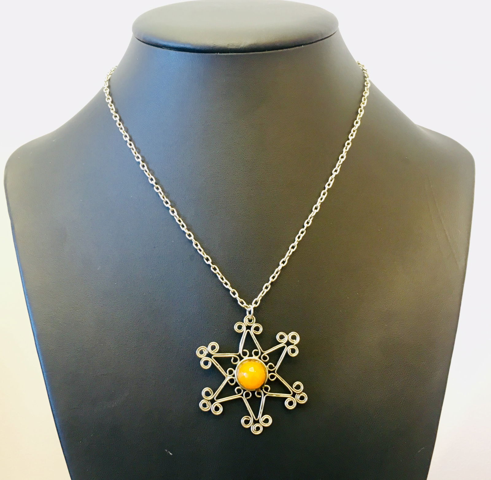 Exquisite Vintage Amber Pendant with chain, shaped like a Star: Title:Exquisite Vintage Amber Pendant with chain, shaped like a StarMetal:NoneGemstone:AmberWeight:12.02 gSize:Size: 46.68 x 46.68 x 9.5 mm Size: 1.838 x 1.838 x 0.374 inches Made of:(Reconstituted