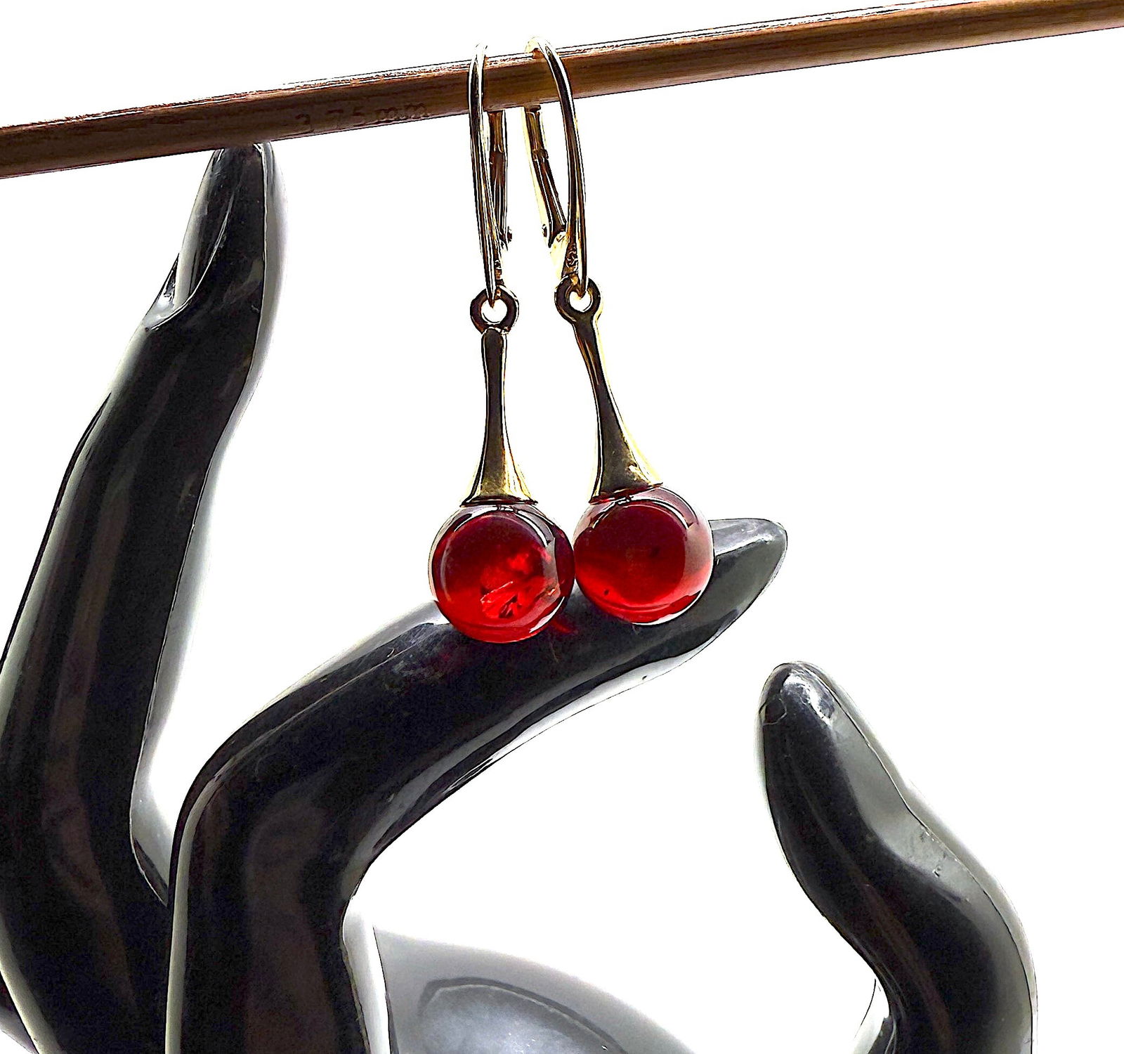 Impressive Amber Earrings: Title:Impressive Amber EarringsMetal:925 Silver-Gold PlatedGemstone:AmberWeight:3.7 gSize:Size: 10.0 x 10.0 x 40.0 mm Size: 0.394 x 0.394 x 1.575 inches Made of:(Reconstituted Amber or Whole