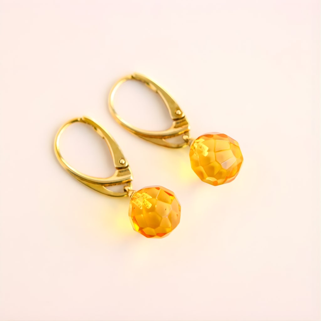 Lemon Drop Amber Earrings in 14k Gold Plated Sterling Silver: Title:Lemon Drop Amber Earrings in 14k Gold Plated Sterling Silver Description:These amber earrings feature faceted lemon amber gemstones set in 14k gold plated sterling silver and finished with a sec