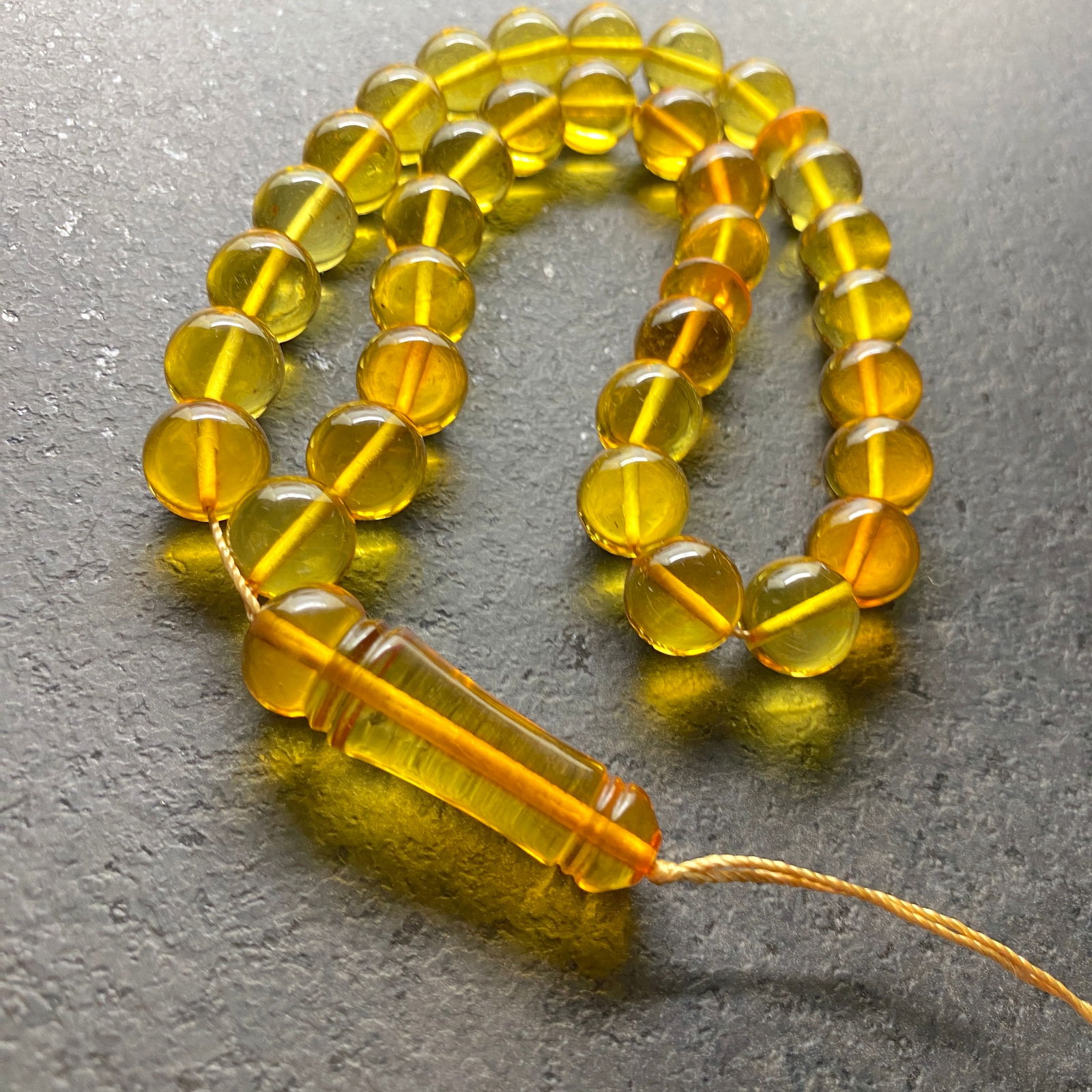 Splendid Amber Tesbih made from Round Amber beads: Title:Splendid Amber Tesbih made from Round Amber beadsMetal:NoneGemstone:AmberWeight:34.0 gSize:Bead size: 11.0 mm Bead size: 0.433 inches Made of:(Reconstituted Amber or Whole Stone):Reconstituted